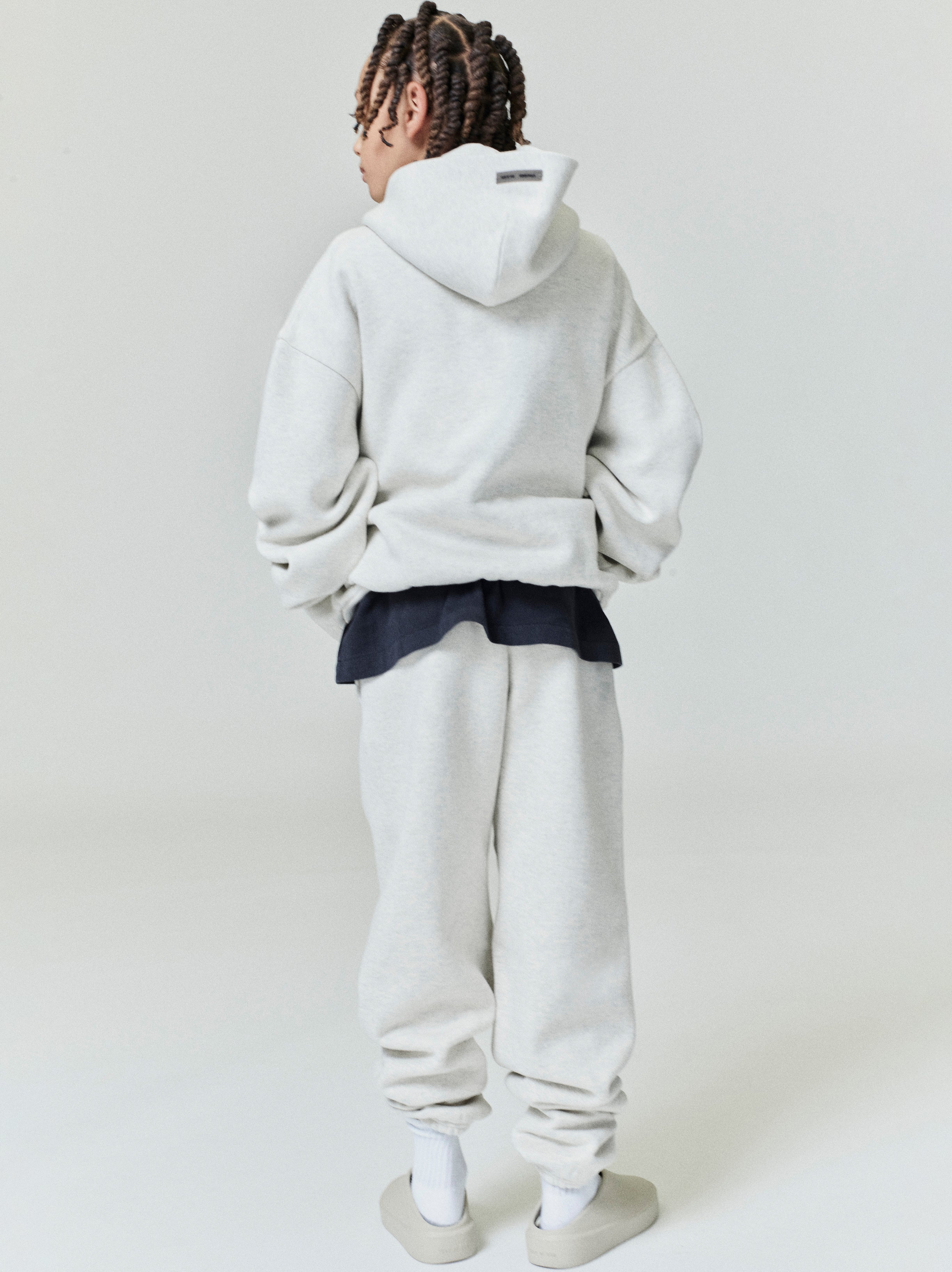 Rear view of oatmeal Kids Embossed Classic Hoodie showing relaxed fit and hood, gallery position 0, file 0000_HO25_K_L76_4071.jpg
