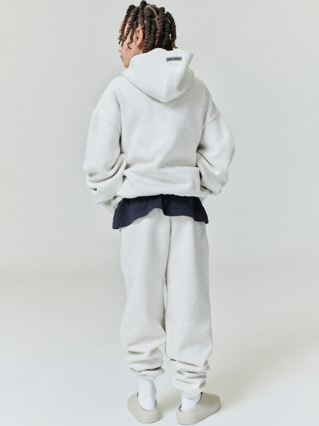 Rear view of child wearing light grey Kids Classic Sweatpant with relaxed fit and oversized matching hoodie, gallery position 0