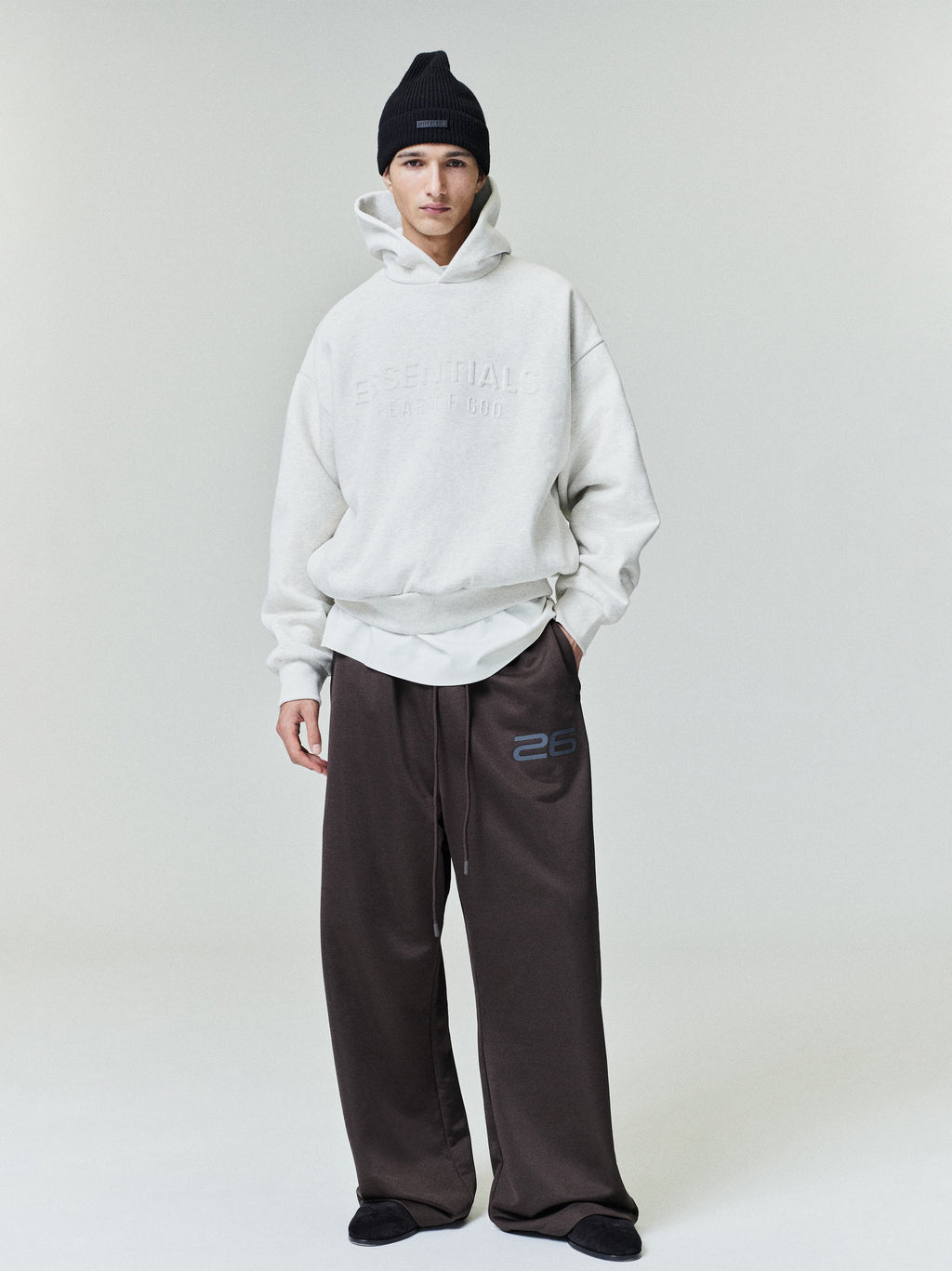 Model wearing dark brown Satin Fleece Lounge Sweatpant with relaxed wide leg and drawstring waist, gallery 0 file 0007_HO25_F_L28_P30_3394copy.jpg