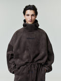 Portrait of model wearing dark brown suede fleece modern hoodie with high funnel neck, file 0022_HO25_F_L17_2137_OnModelImage.jpg