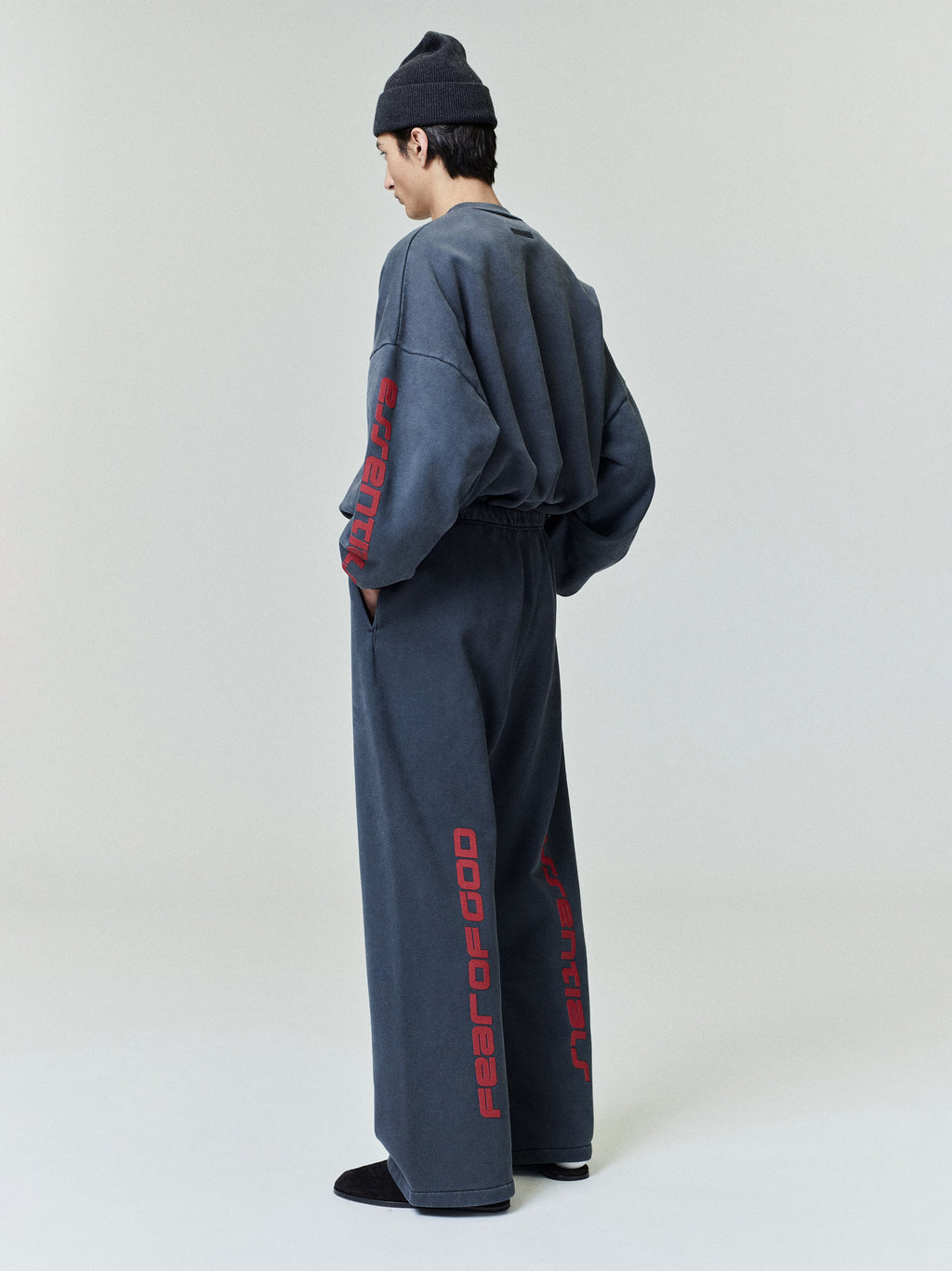 Rear view of model wearing faded navy Chicago heavy fleece cropped sweatshirt and matching wide-leg pants 0036_HO25_F_L07_P13_0802_OnModelImage.jpg