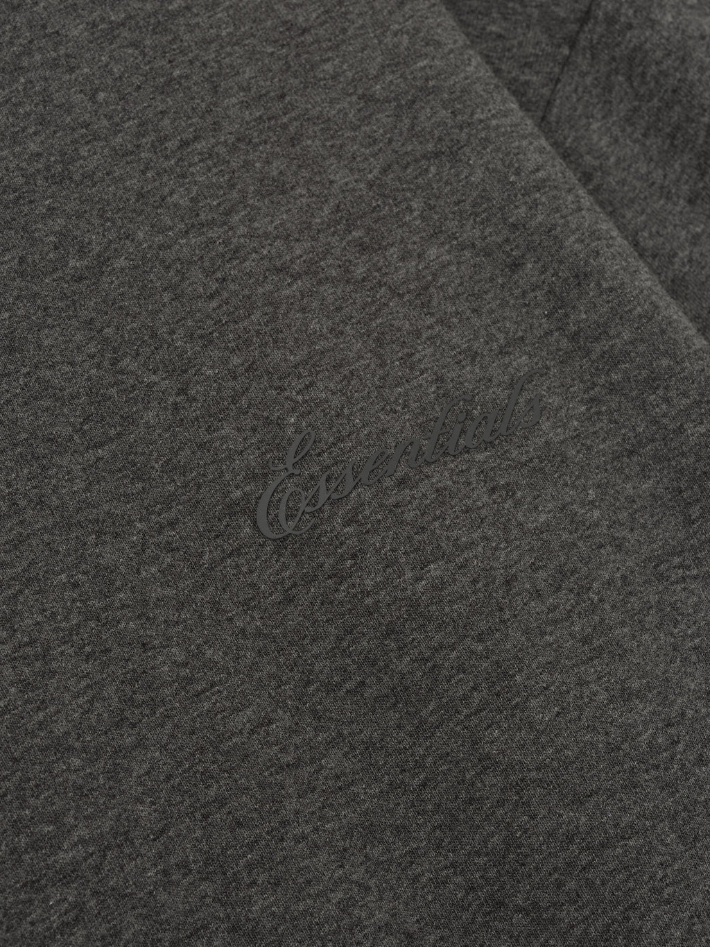 Close-up of charcoal heather Embroidered Classic Fit Long Sleeve showing tonal Essentials logo detail, gallery image 0