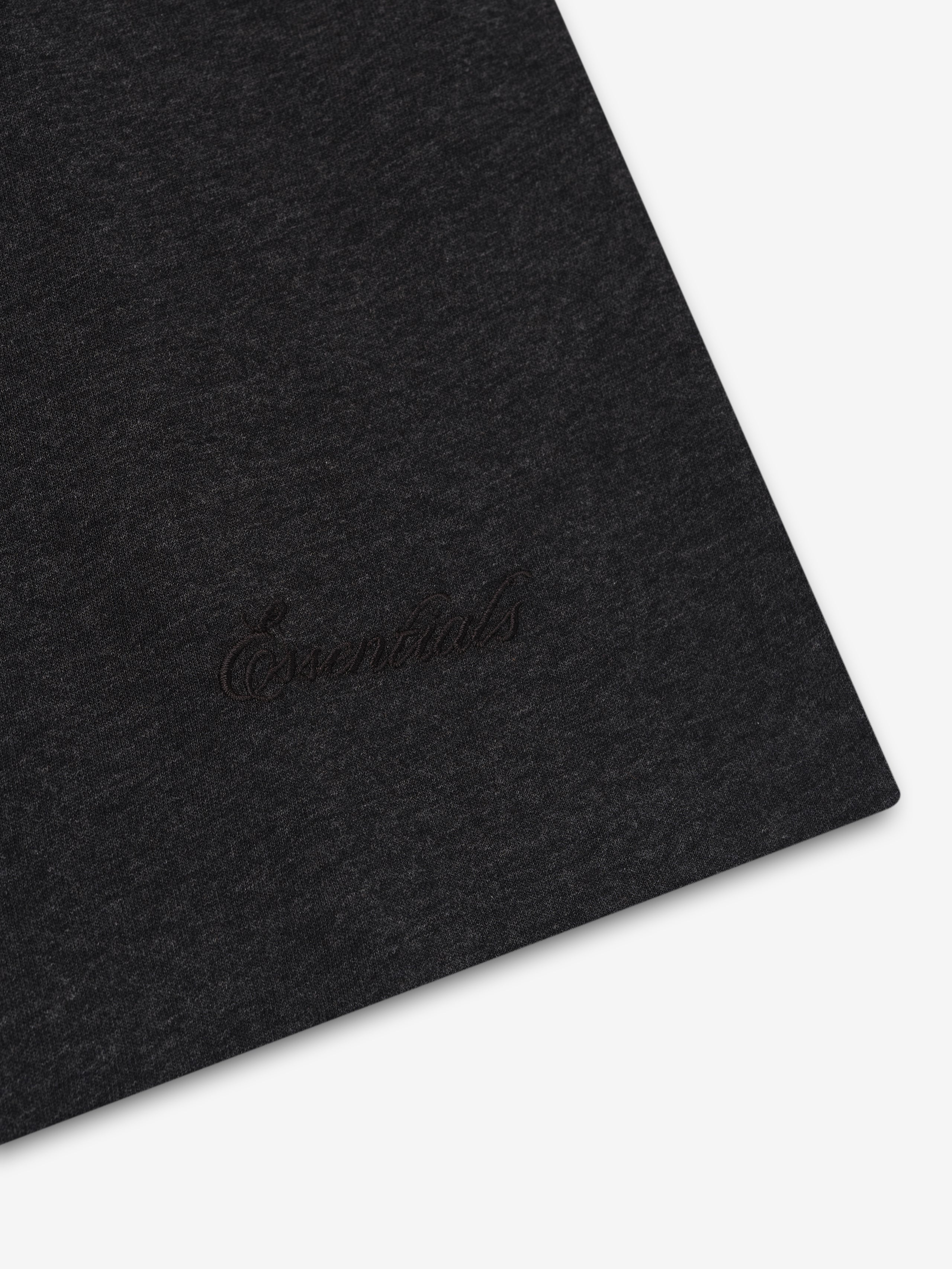 Vintage black Embroidered Essential Tank showing close-up of tonal Essentials embroidery near hem, gallery image 0