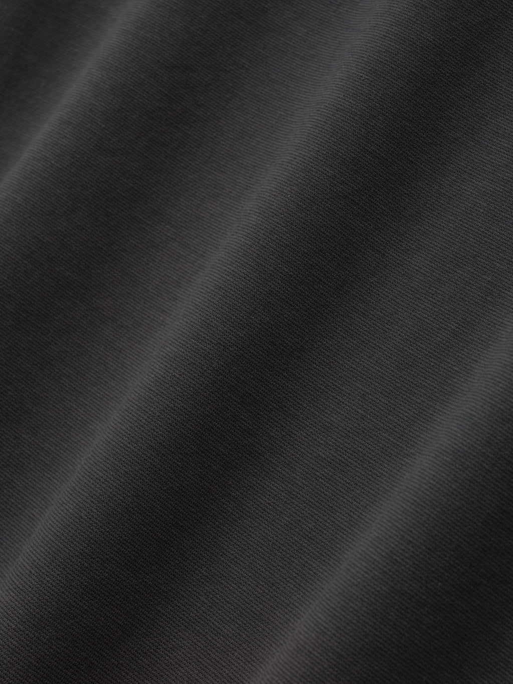 Close-up texture of iron grey Ponte 90s Tee fabric highlighting smooth, soft knit weave in first gallery image