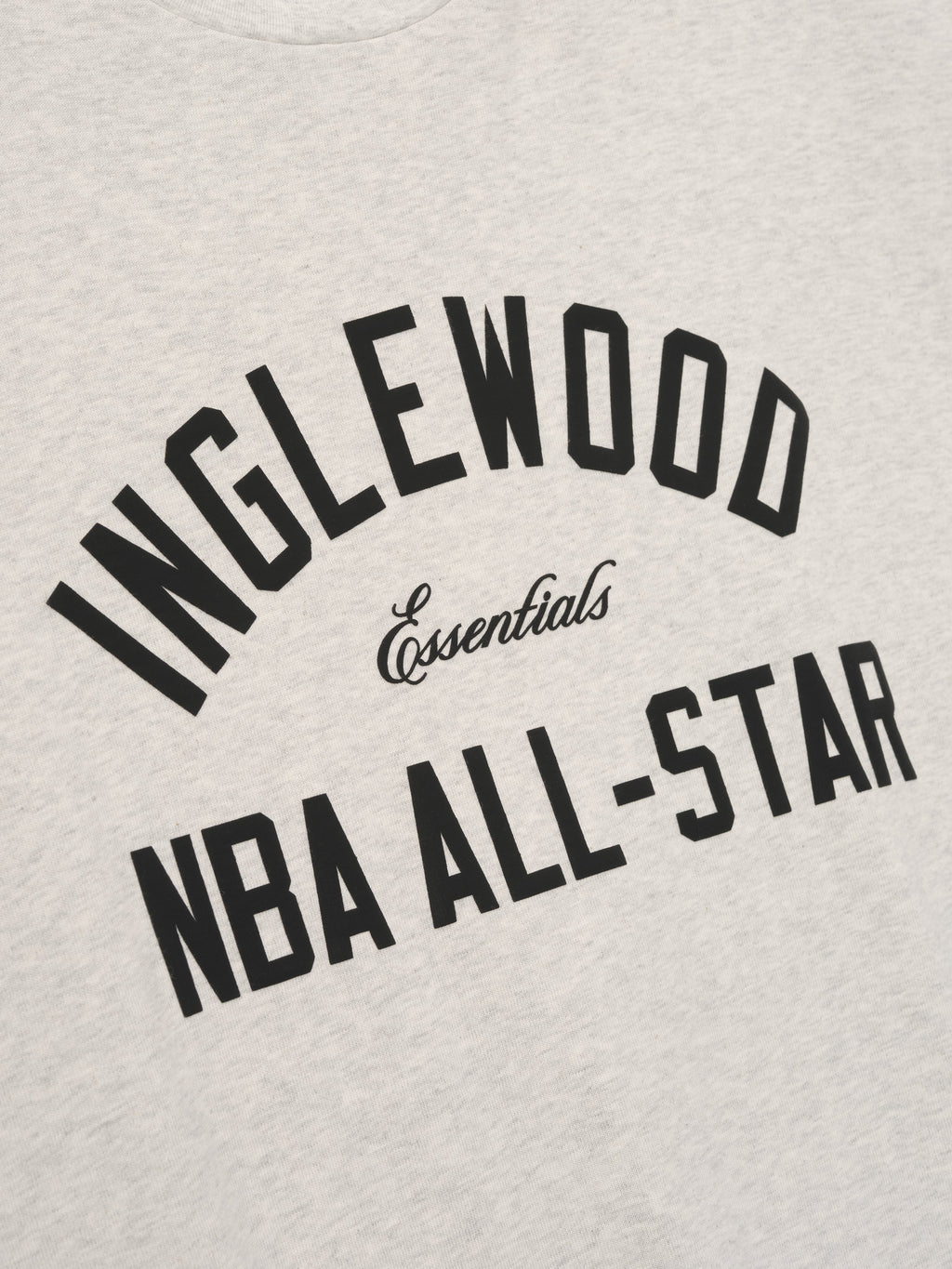 light beige cotton tee with bold Inglewood NBA All-Star arched text and Essentials script center chest design