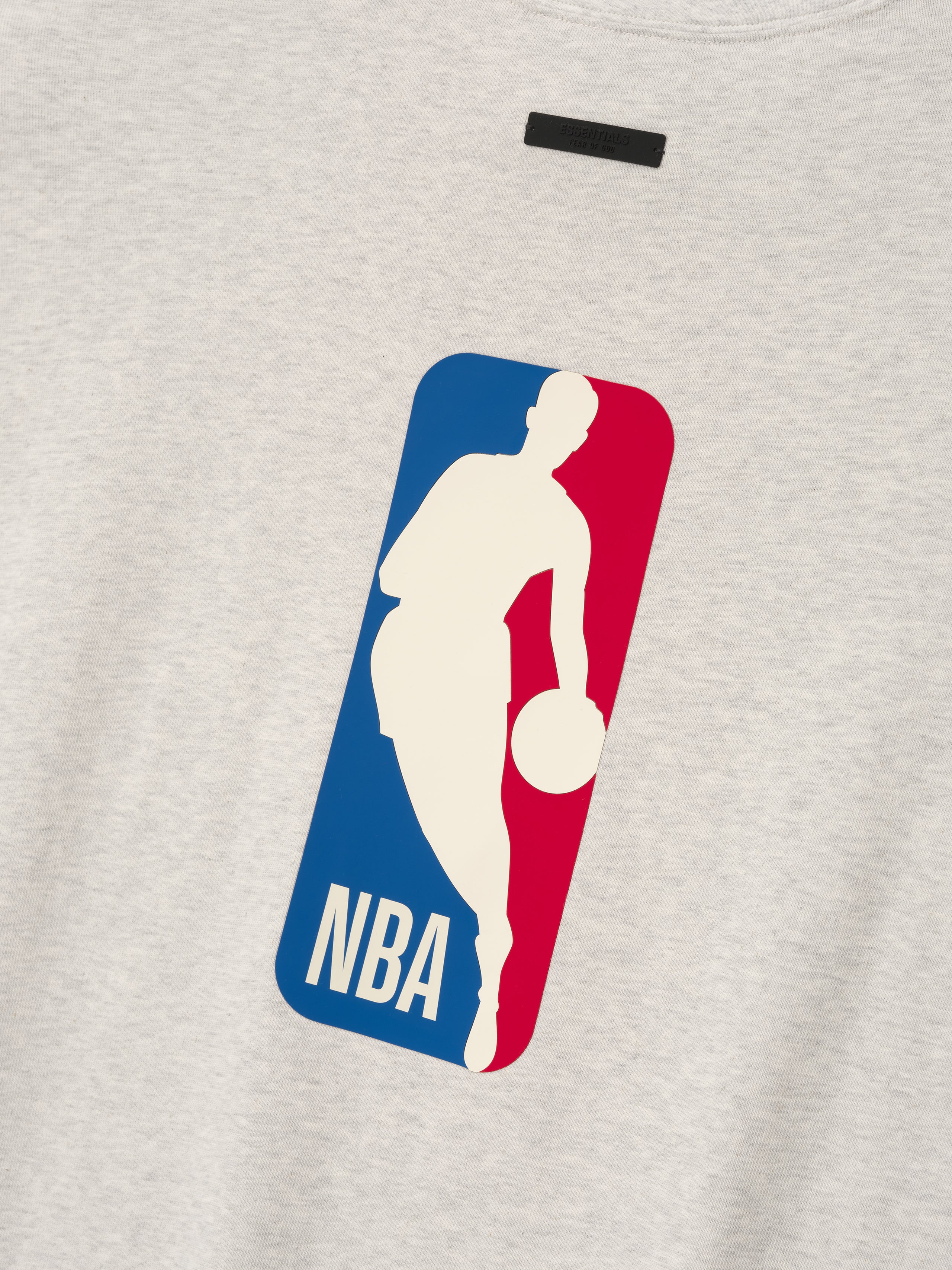 light beige heavy cotton oversized 90s tee with classic NBA logo silhouette centered on front chest