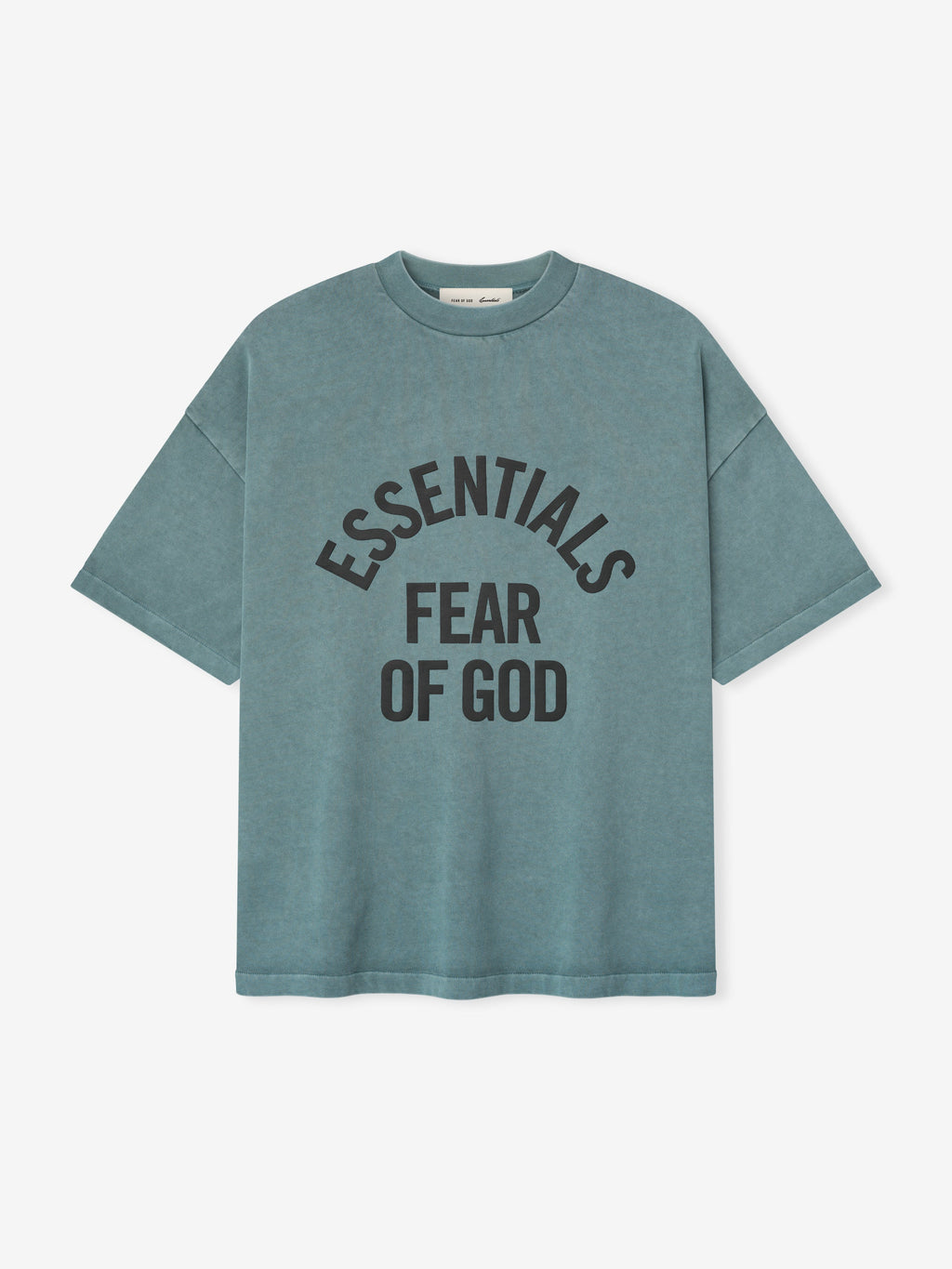 pigment-dyed heavyweight cotton crewneck tee in faded blue with bold "ESSENTIALS FEAR OF GOD" text curved on front