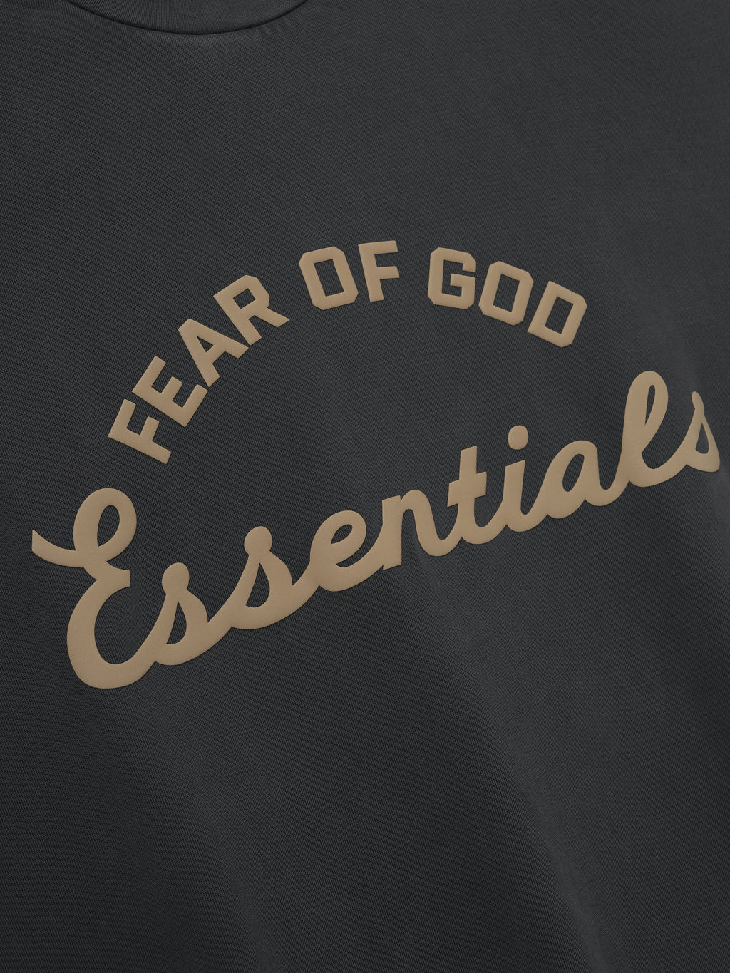 black heavyweight cotton tee with vintage pigment-dye and arched Fear of God Essentials script on front