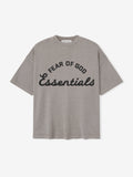 Gray t-shirt with 'Fear of God Essentials' text on a white background