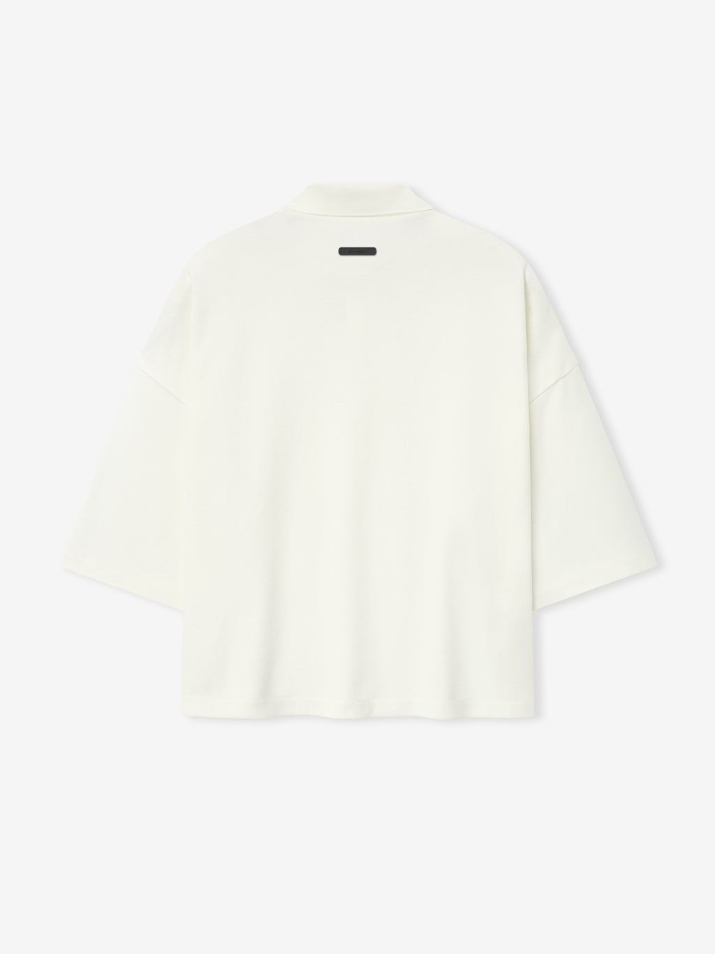 back view of off-white medium-weight cotton poly pique cropped polo with oversized 90s fit and wide 3/4 sleeves