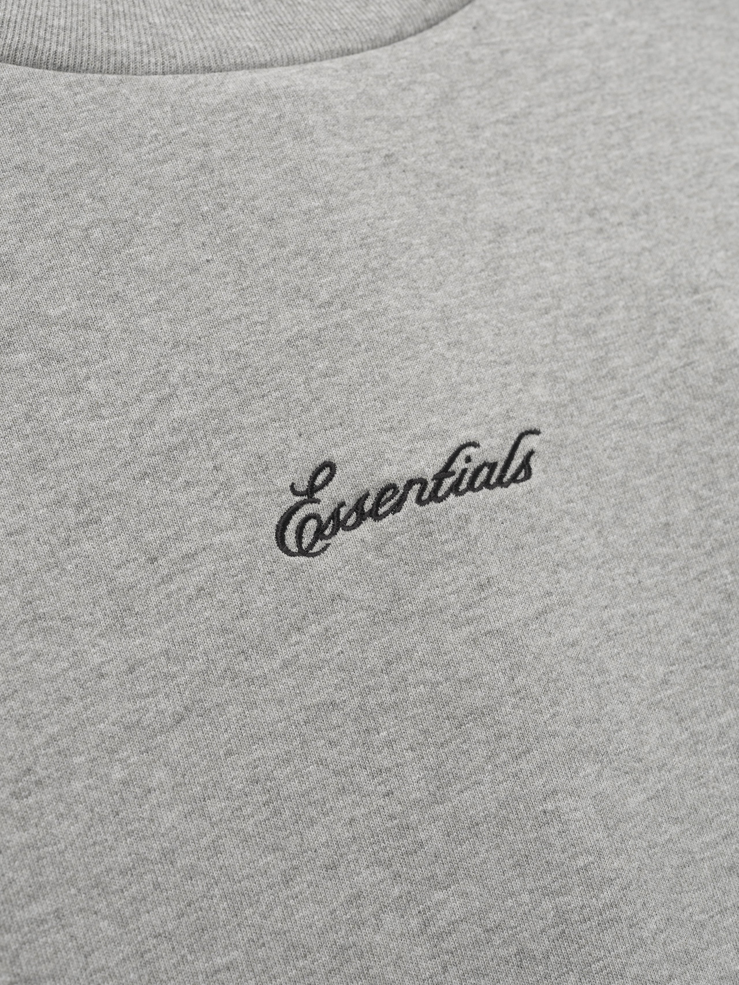 Gray t-shirt with 'essentials' logo.