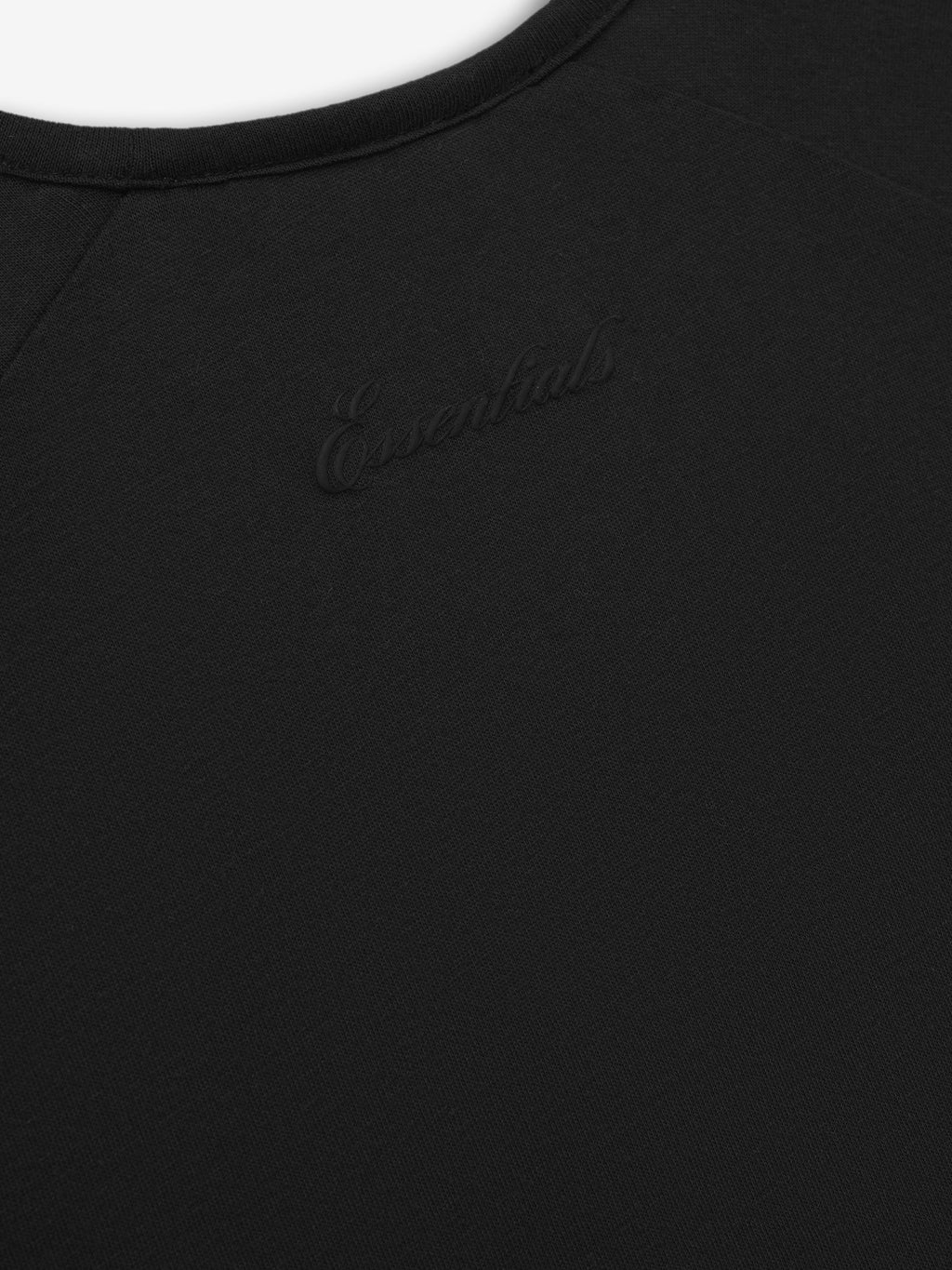 Black t-shirt with 'Essential' logo on a white background