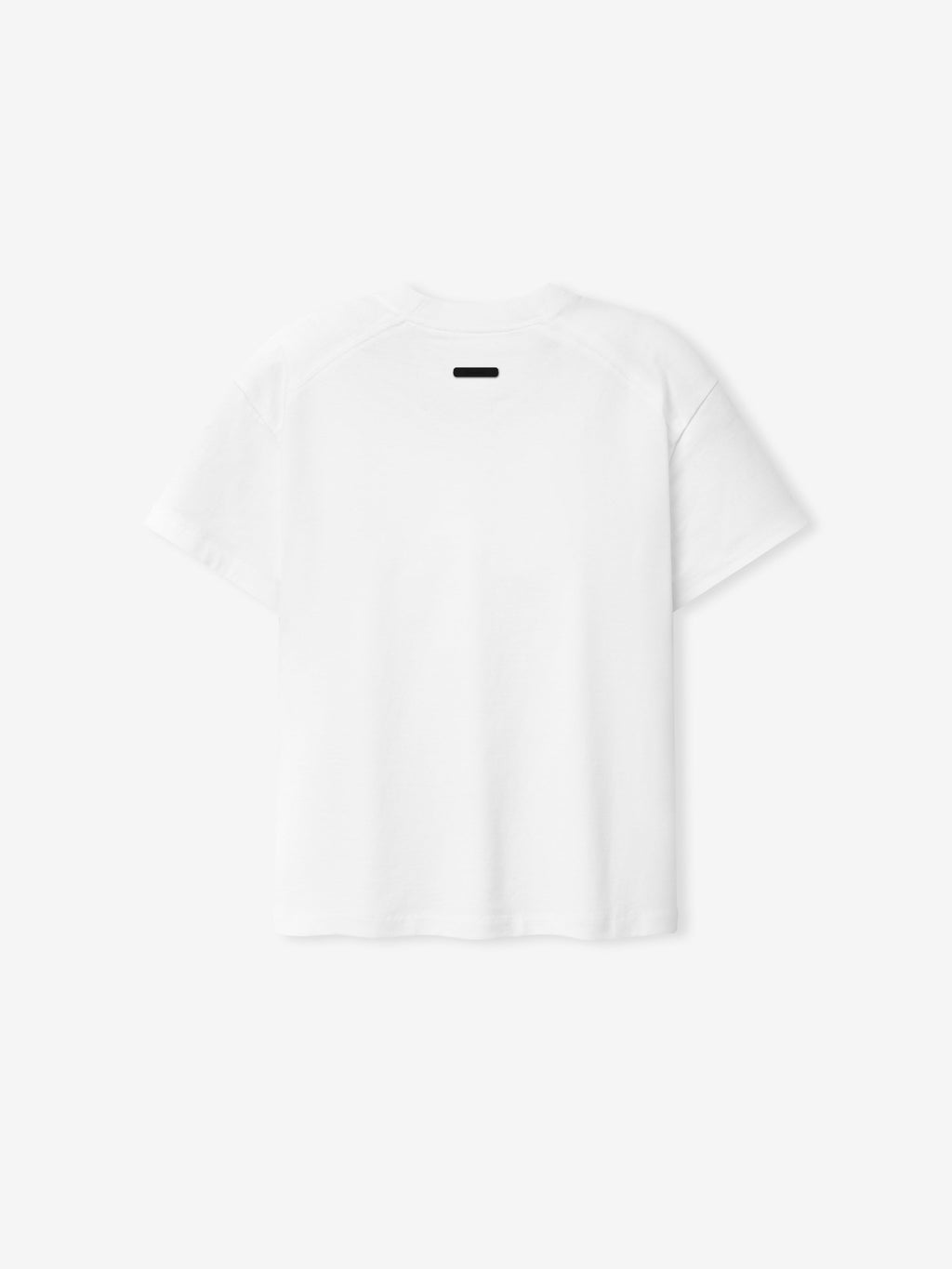 Back view of the Signature SS26 Classic Tee in bright white, made from soft cotton fabric with a minimalist design featuring a small black tag at the neckline, ideal for casual wear.