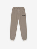 Beige sweatpants with a brand logo on a white background