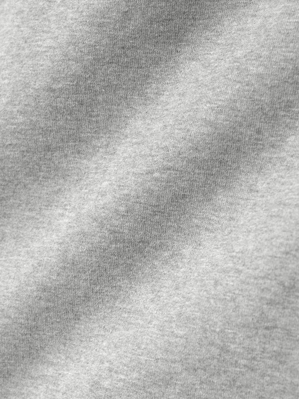 close-up of light gray heavyweight cotton fleece fabric showing soft texture and knit pattern detail