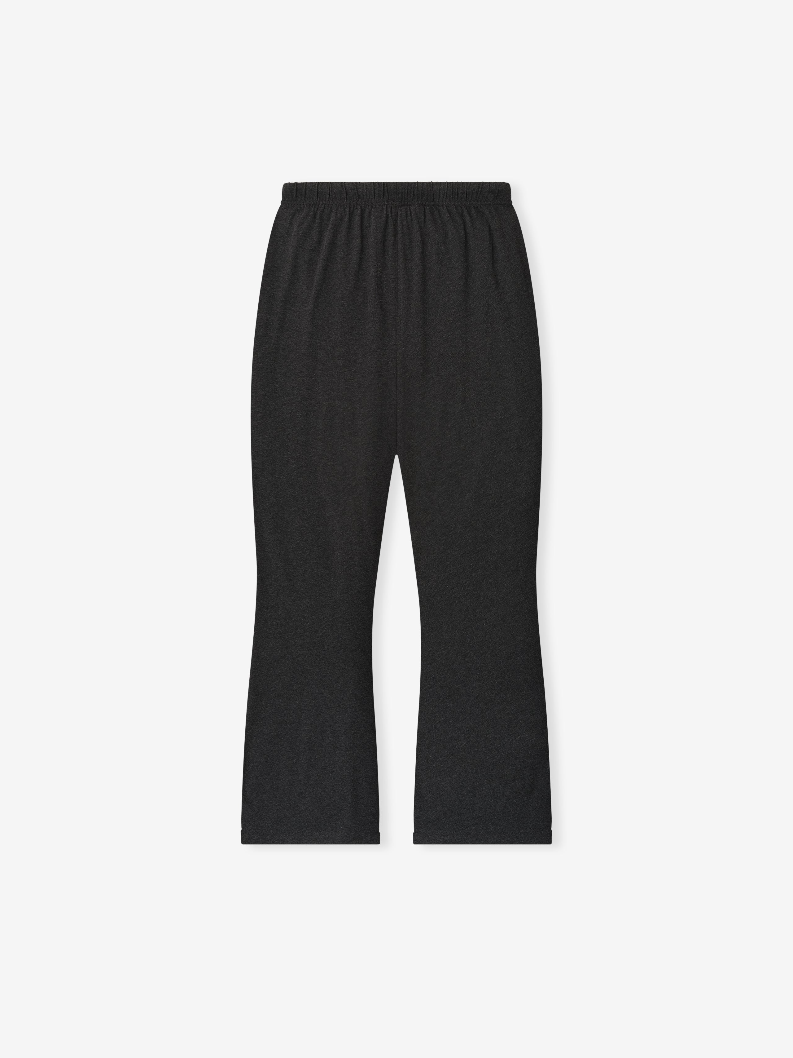Straight flat lay of vintage black Womens Jersey Flare Sweatpant showing elastic waistband on plain white background