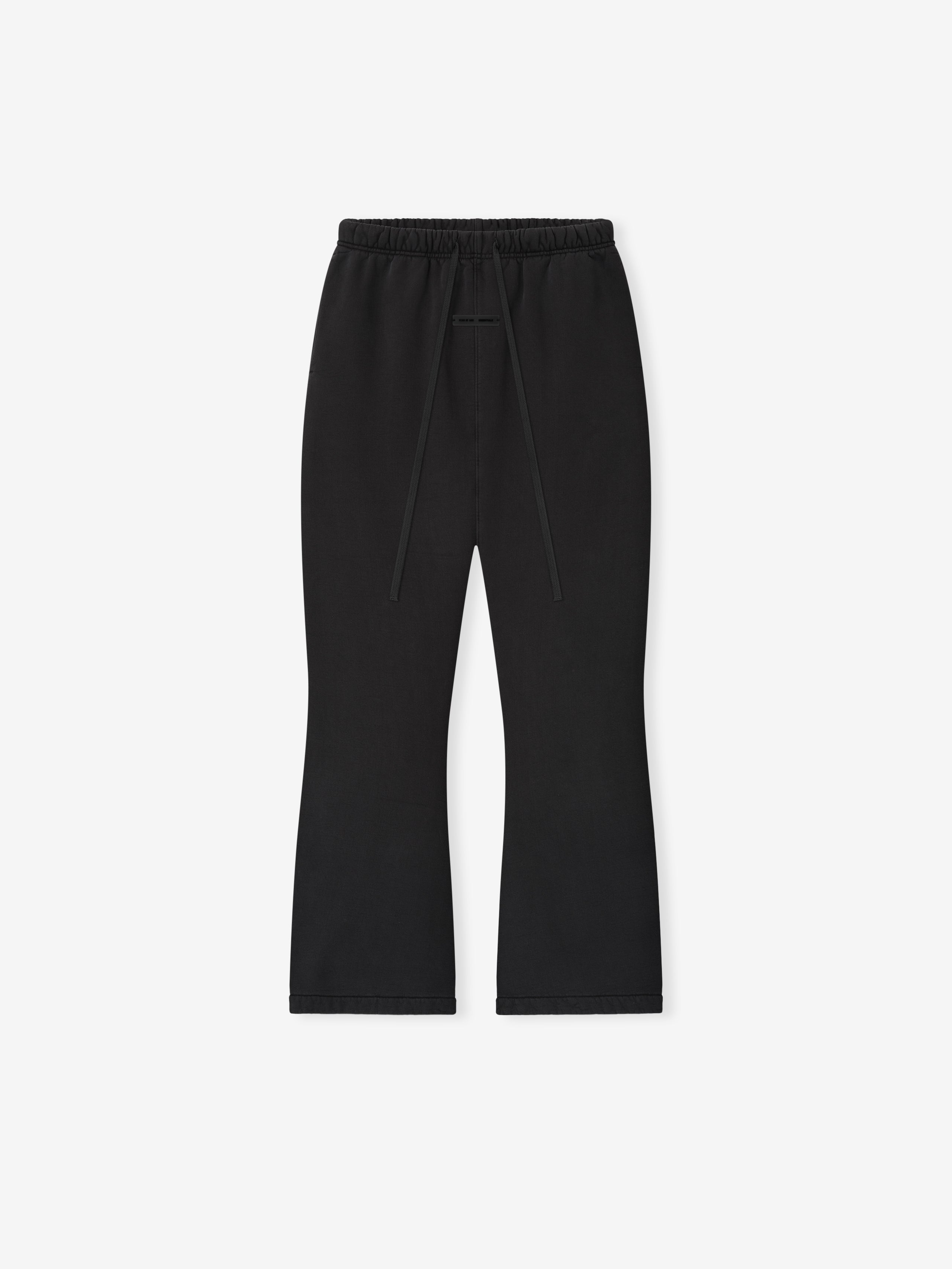 Flat lay of vintage black Womens Heavy Fleece Flare Sweatpant with elastic waistband and long drawstrings on light background