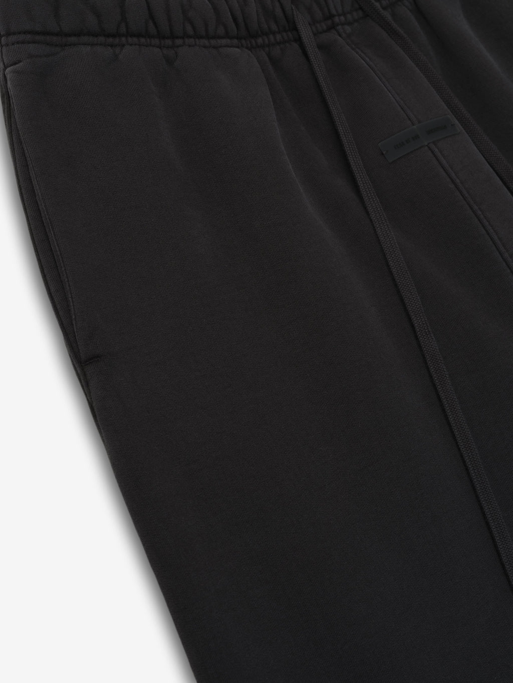 Detailed close-up of vintage black Womens Heavy Fleece Flare Sweatpant showing waistband and side pocket area