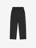 Vintage black Tech Nylon Relaxed Track Pant flat lay showing elastic waistband and vertical Essentials side logo text