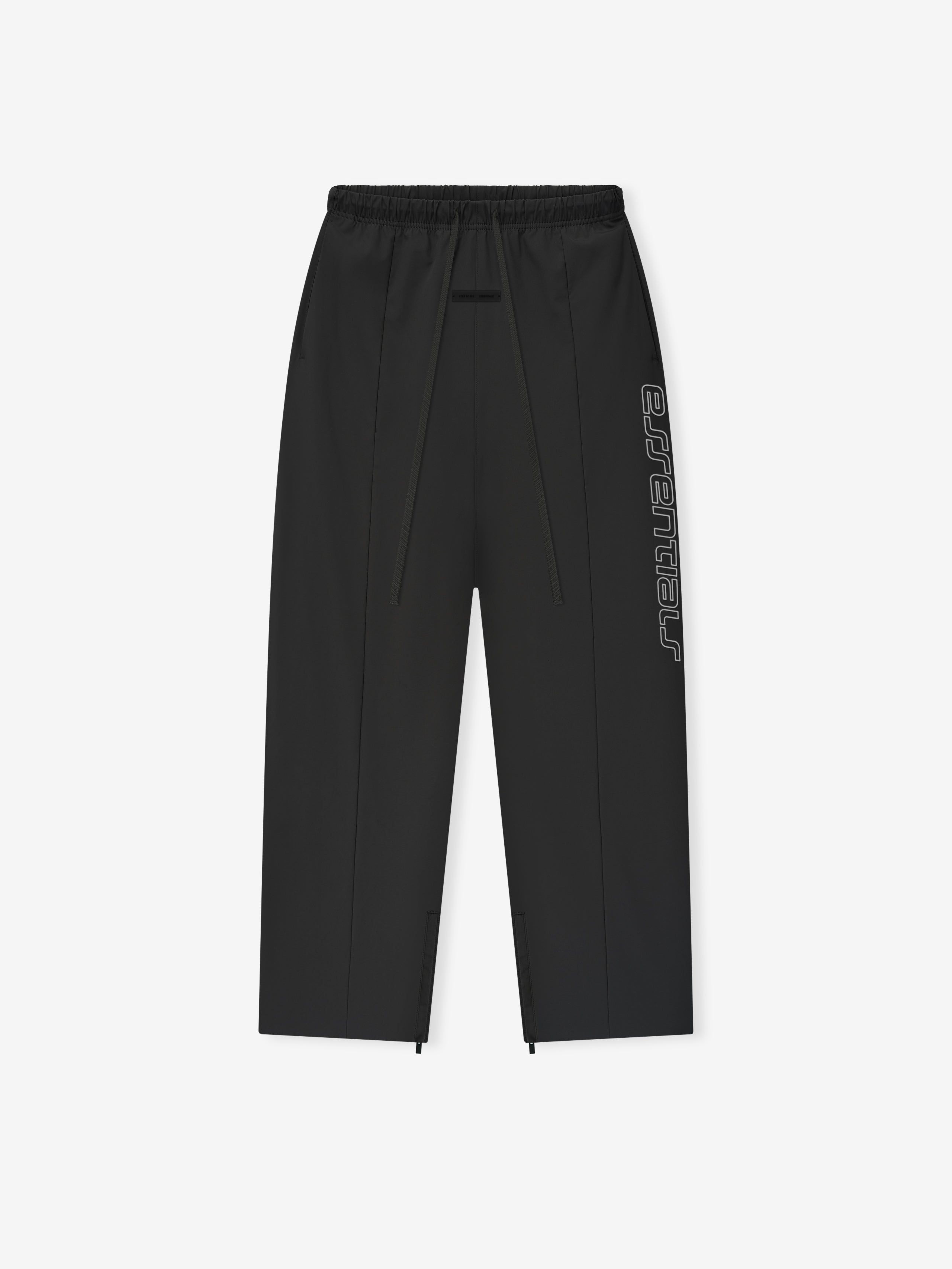 Vintage black Tech Nylon Relaxed Track Pant flat lay showing elastic waistband and vertical Essentials side logo text