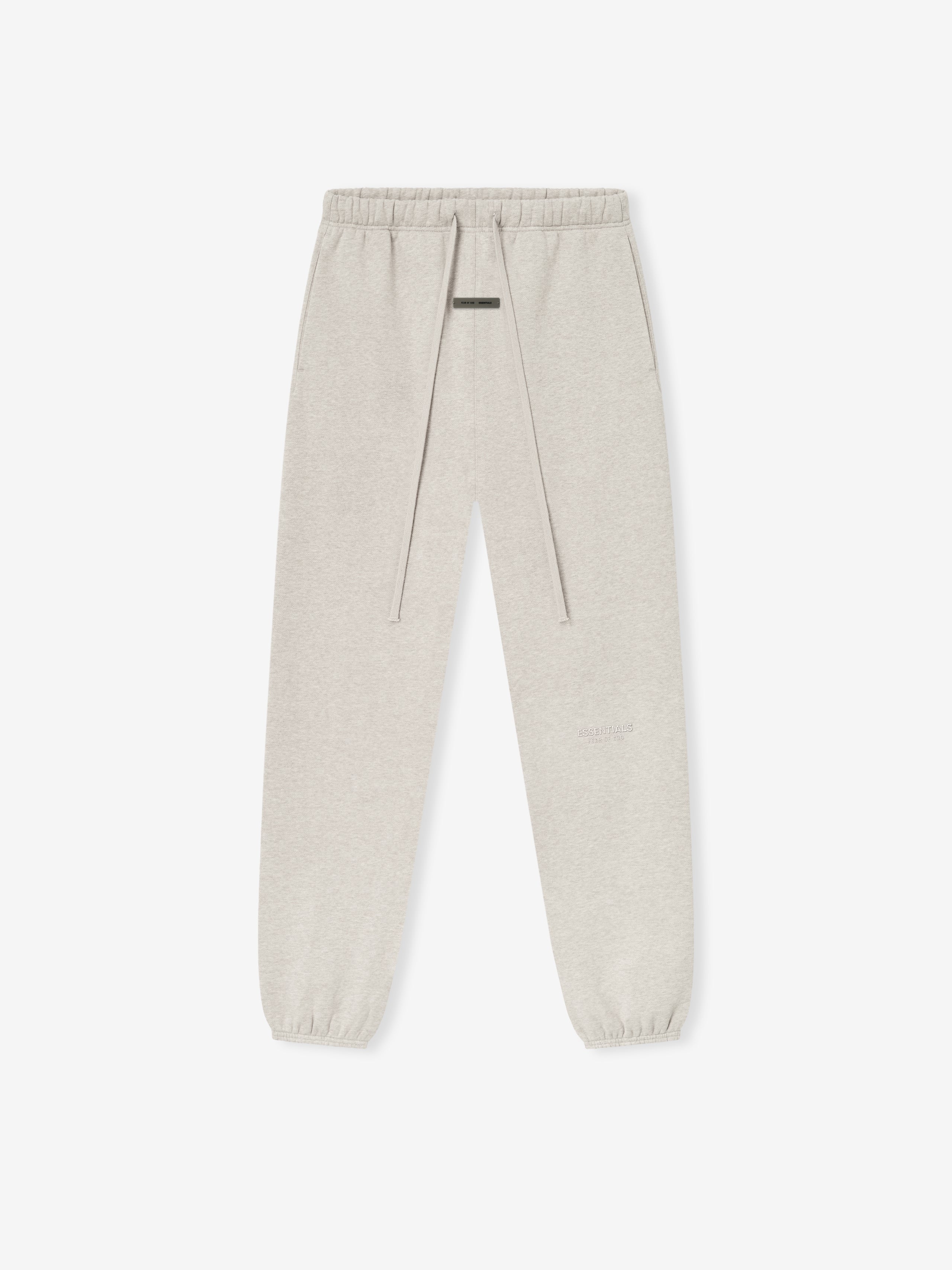 top-down view of beige vintage fleece sweatpant with elastic waistband, long drawstrings, and cuffed ankles