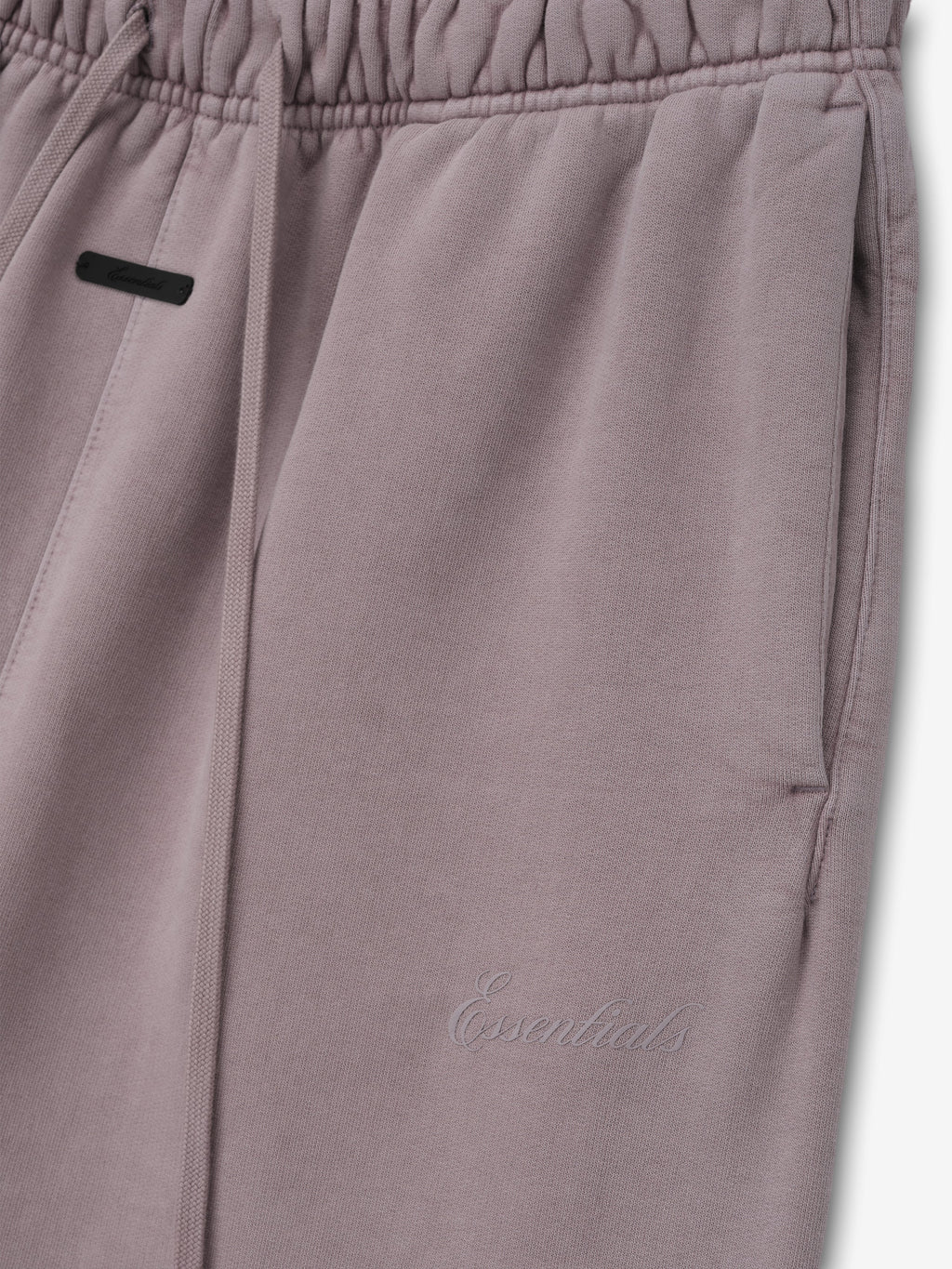 Womens Signature Classic Flare Sweatpant in a muted mauve shade featuring an elastic waistband with drawstrings, side pockets, and subtle tonal Essentials embroidery.