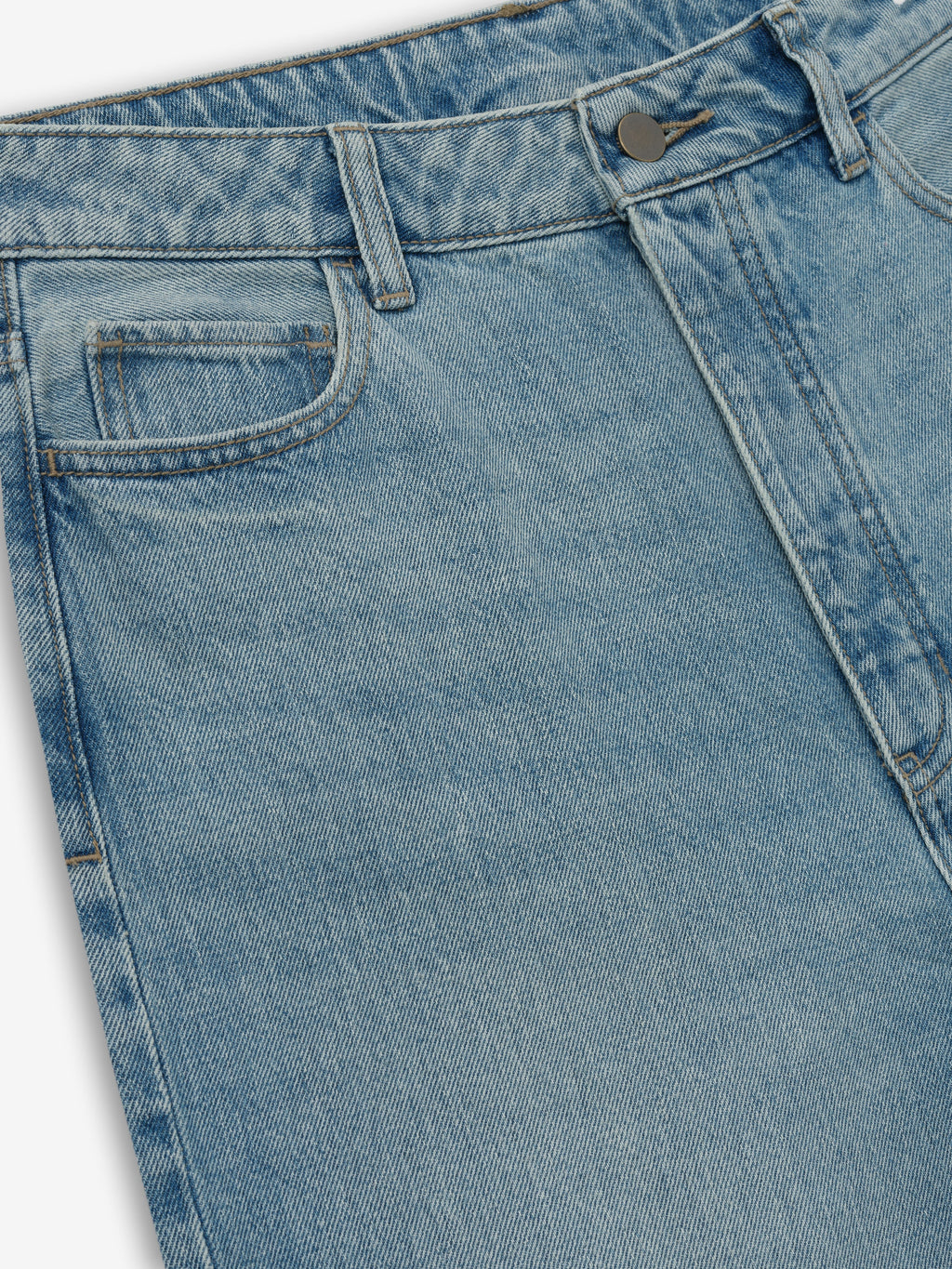 Close-up of light blue denim jeans upper section with front pockets, belt loops, and metal button closure