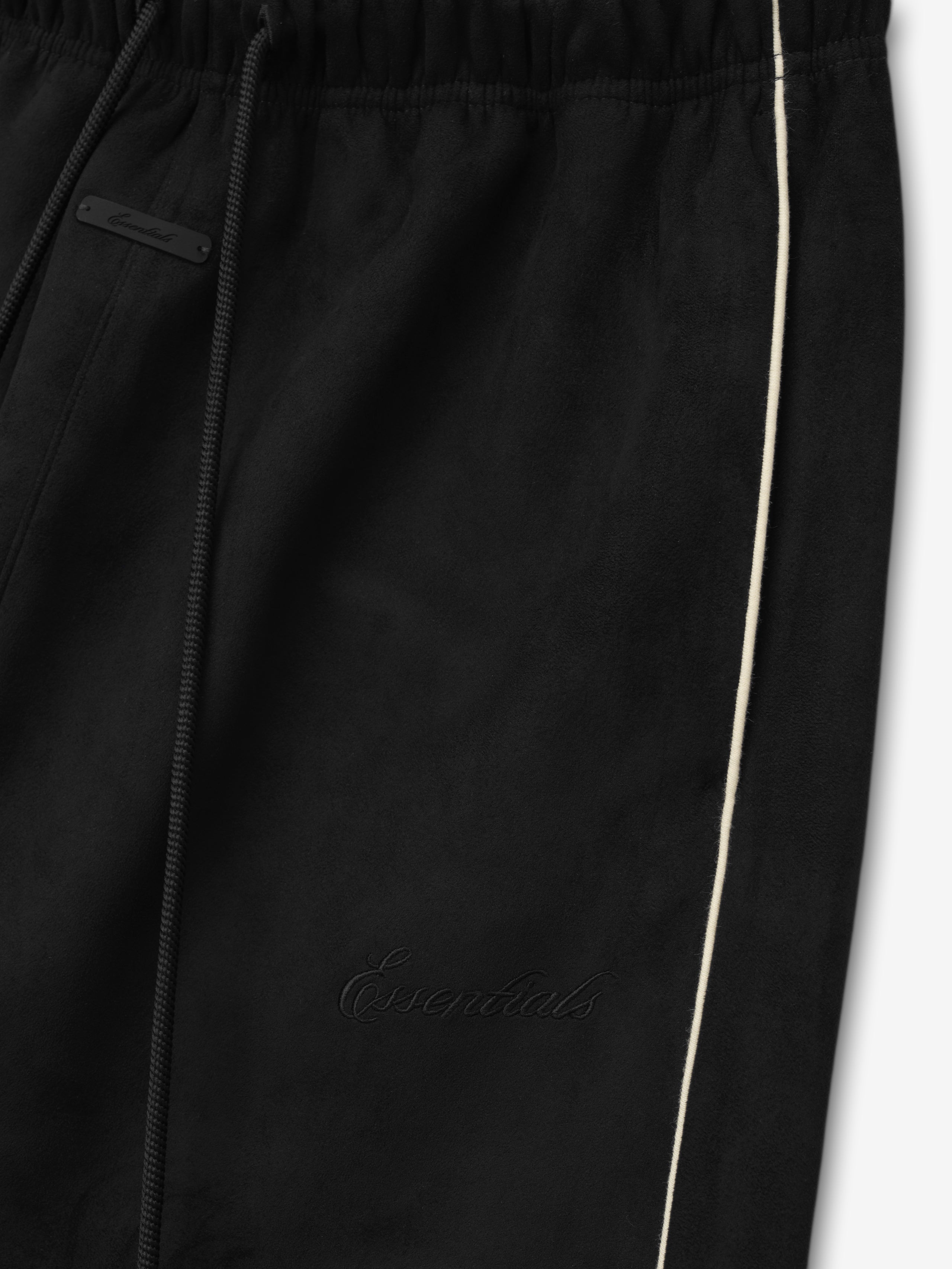 Black pants with a brand logo on a white background