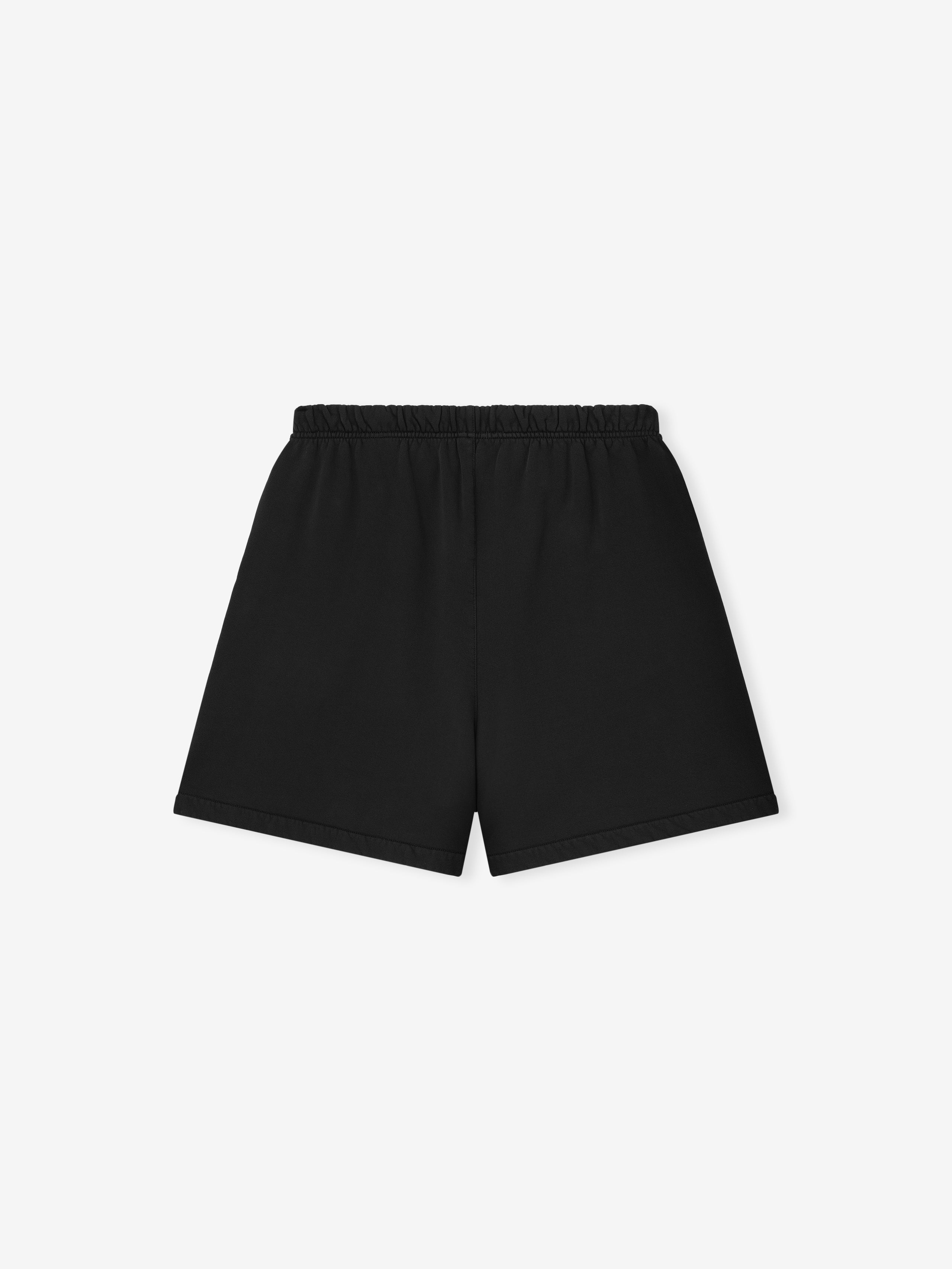 black sweatshorts with elastic waistband made from 380GSM core fleece, featuring subtle Essentials Fear of God logo on leg