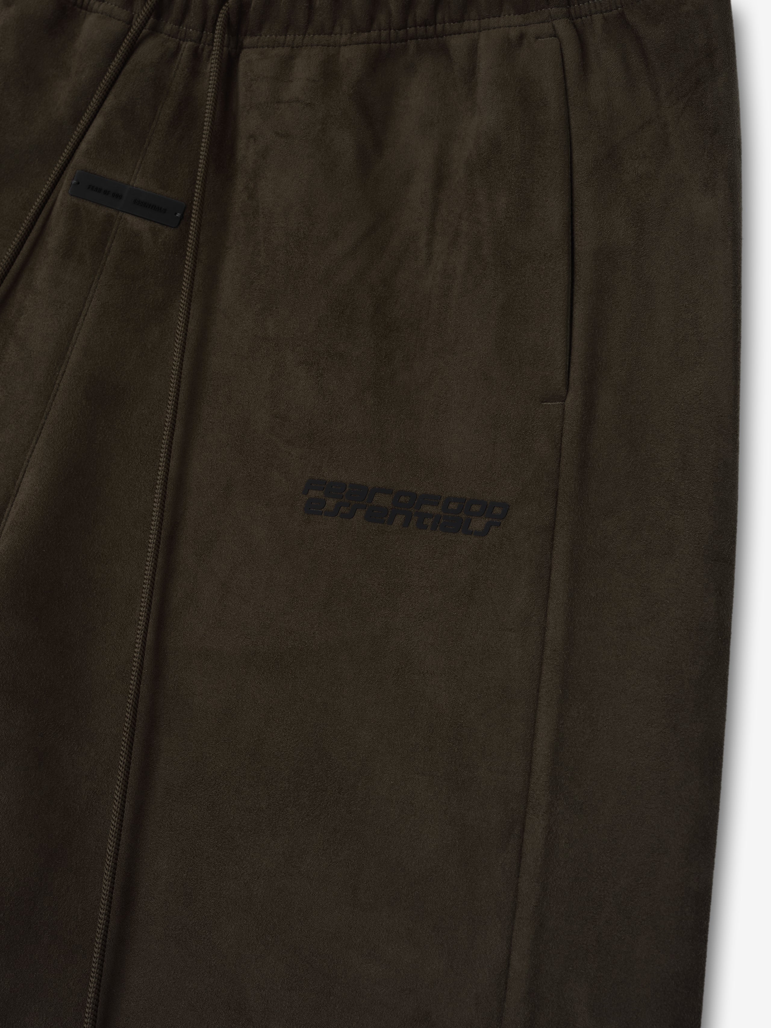 Close-up of brown Suede Fleece Relaxed Short showing elastic waistband, side pocket, and subtle tonal logo print