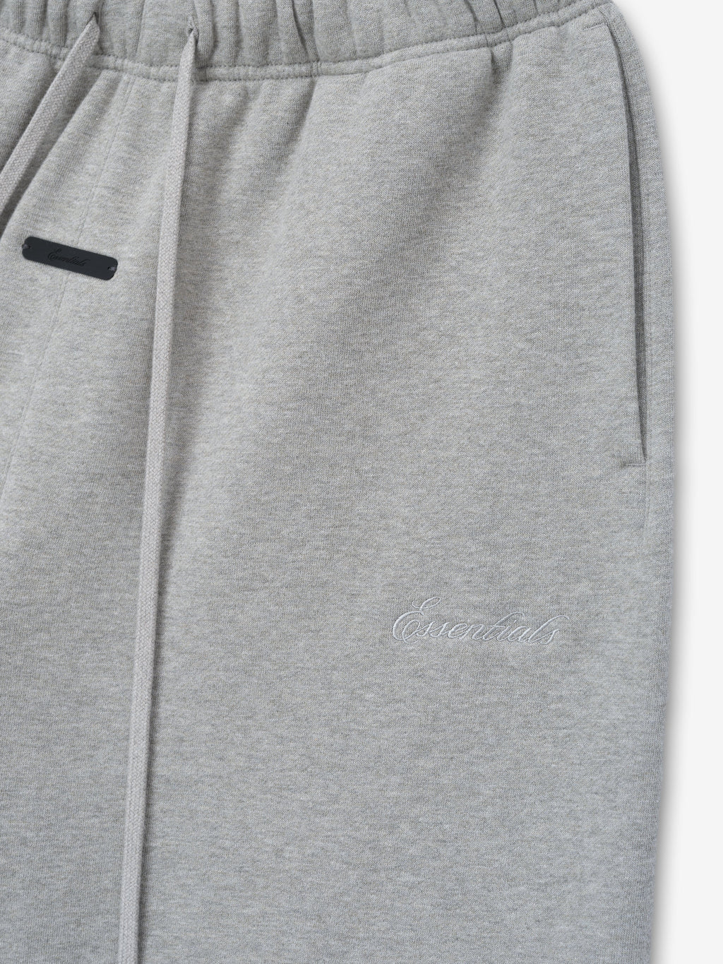 Gray sweatpants with a brand logo on a light gray background