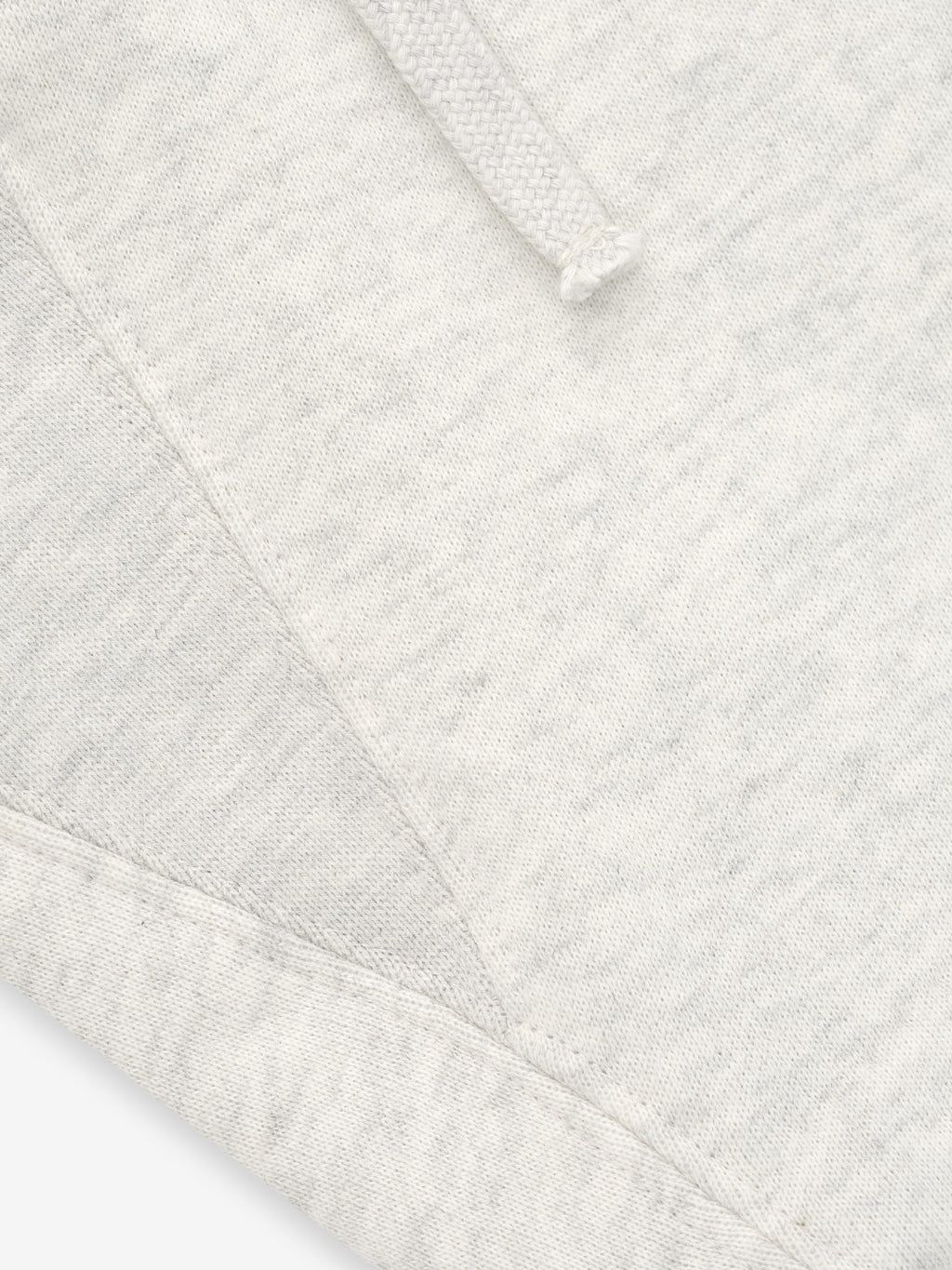 Close-up of a textured white fabric with a diamond pattern