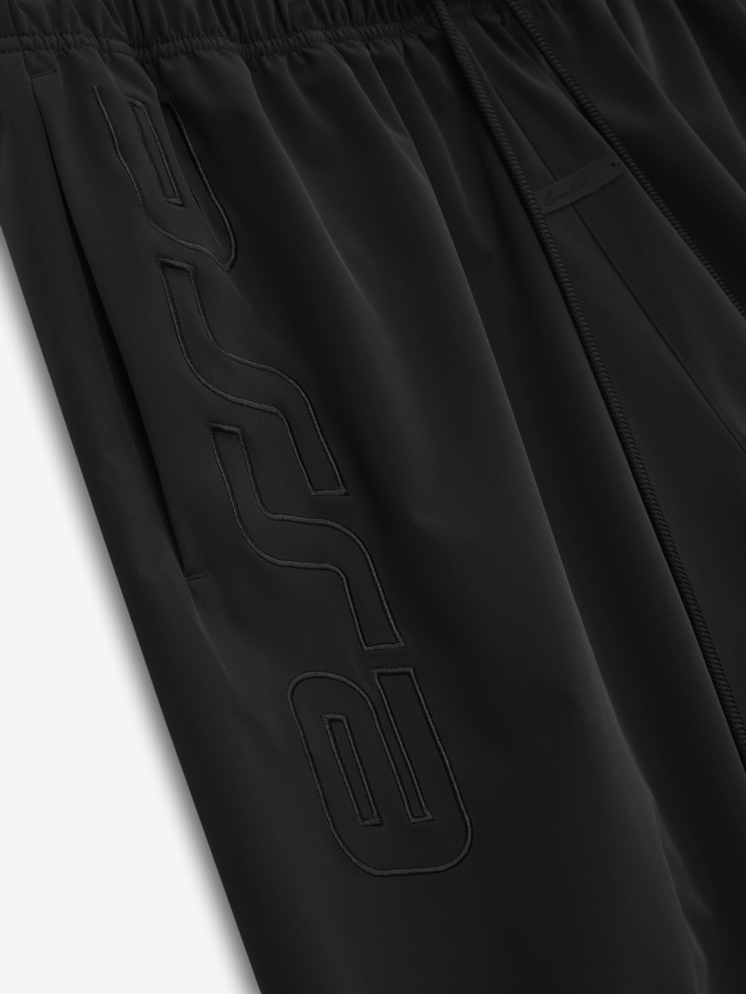 Black pants with a logo on a white background