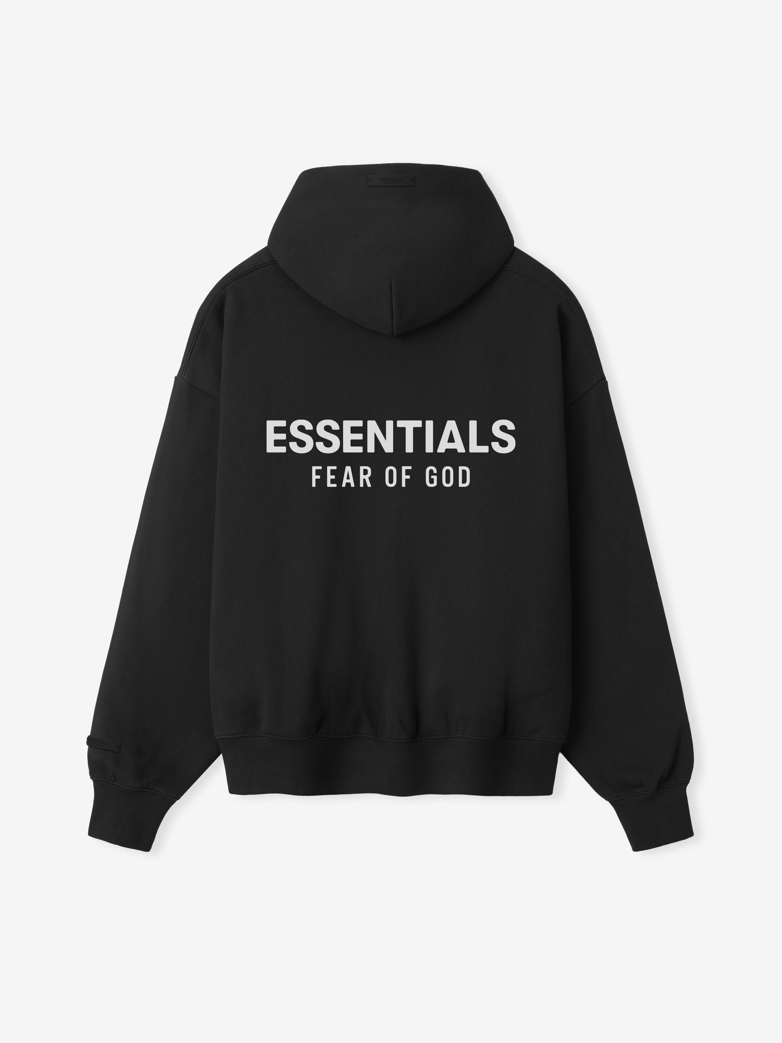 back view of black zip-up hoodie with hood and white Essentials Fear of God logo printed on fabric