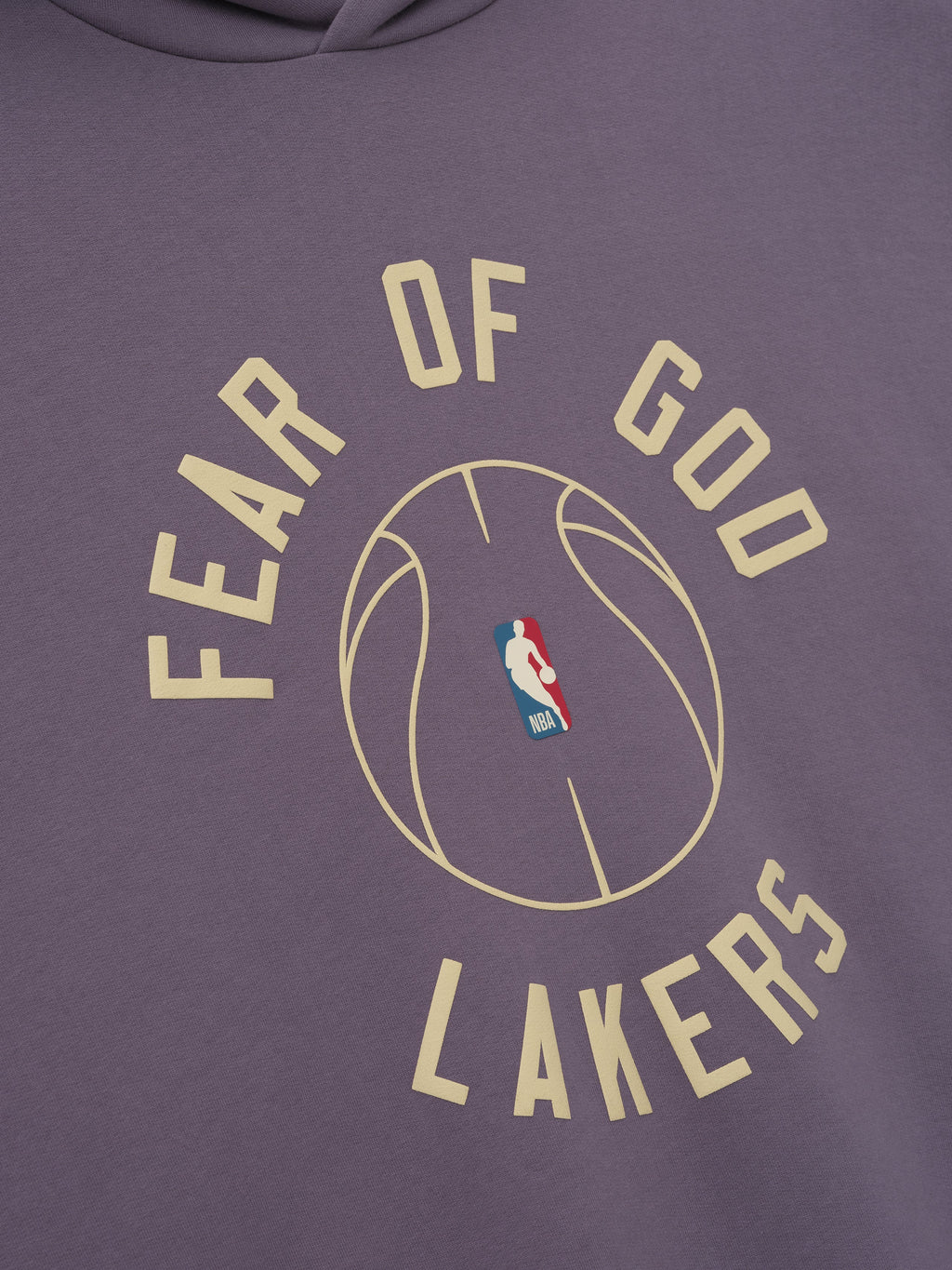 close-up of dusty purple hoodie with puff-printed "FEAR OF GOD LAKERS" text and NBA basketball graphic on front