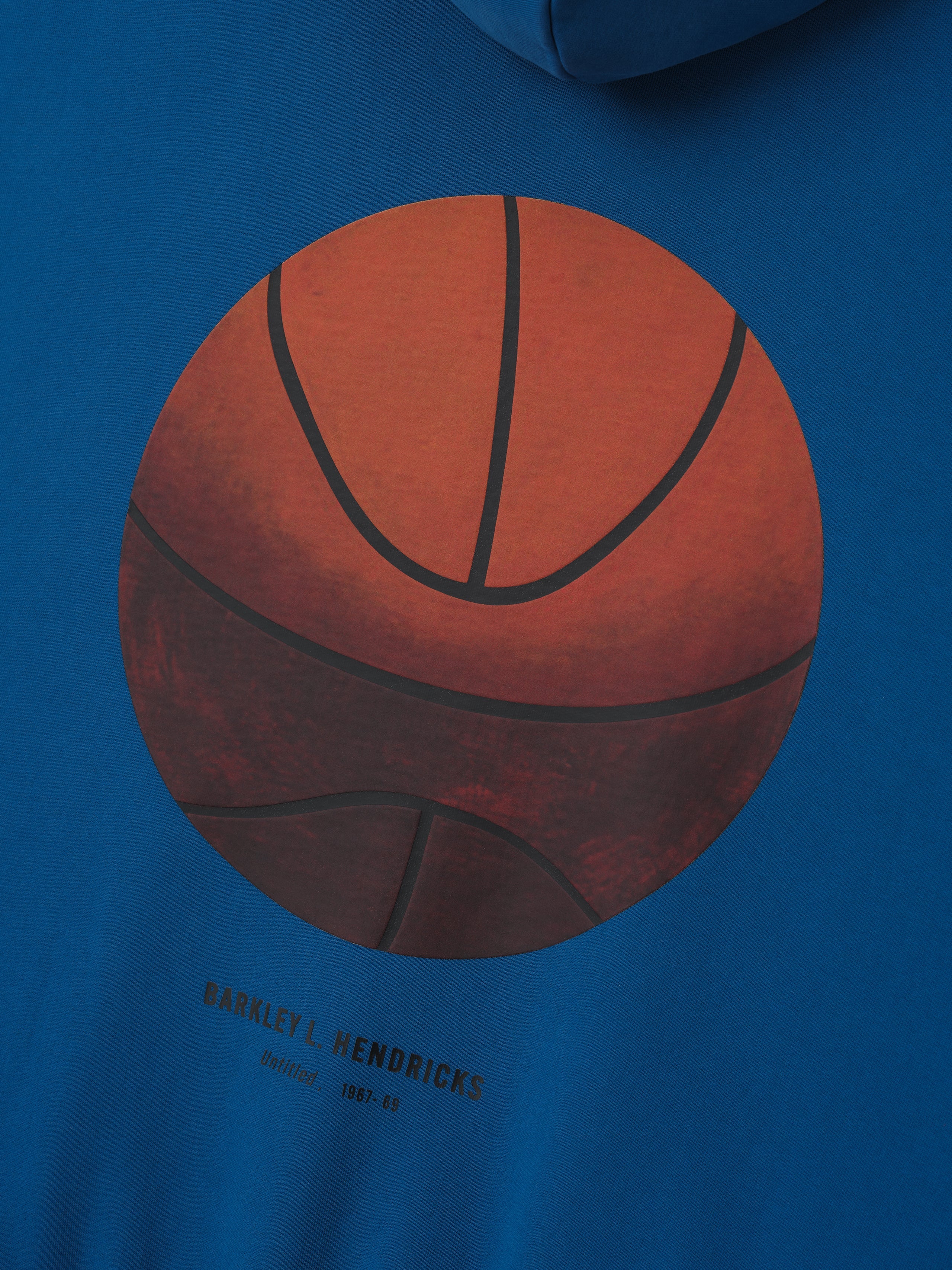 blue heavyweight hoodie with large realistic basketball illustration and Barkley L. Hendricks signature detail below