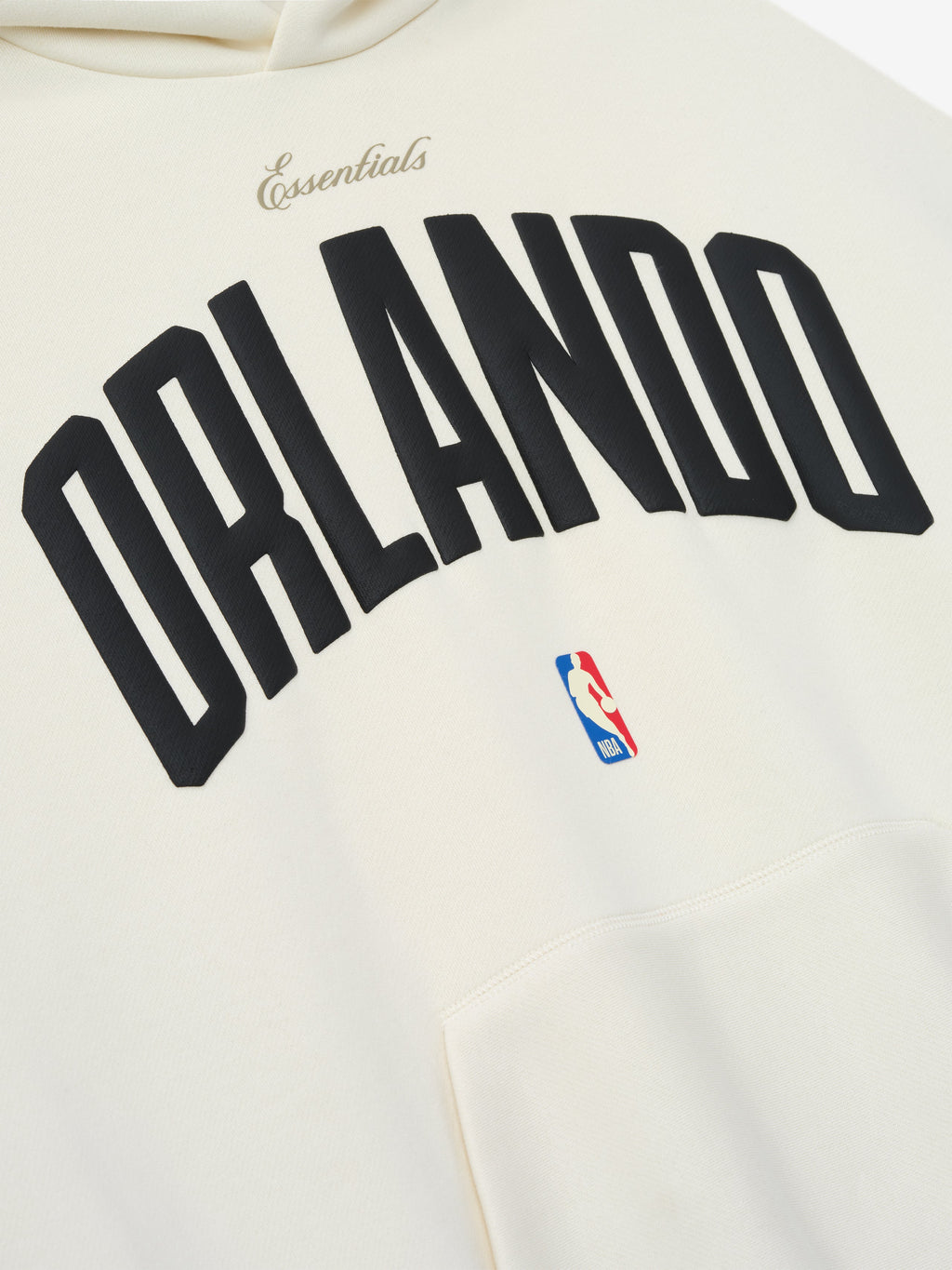 Close-up of cream white Orlando Magic 90s Hoodie with black Orlando text and small NBA logo near pocket, gallery 0.