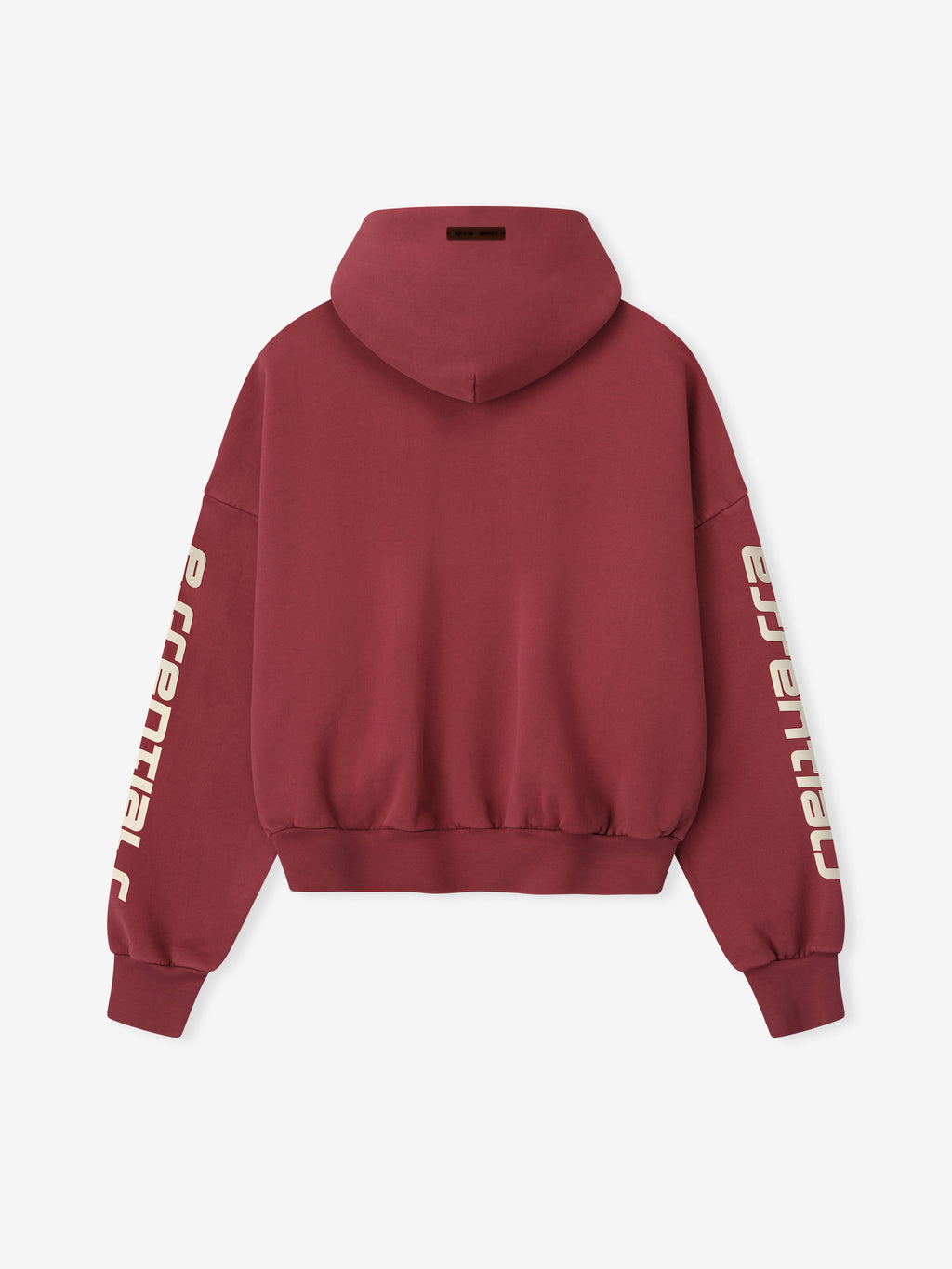 Back view of crimson cropped relaxed hoodie with cream Essentials logo printed vertically on both sleeves and ribbed hem