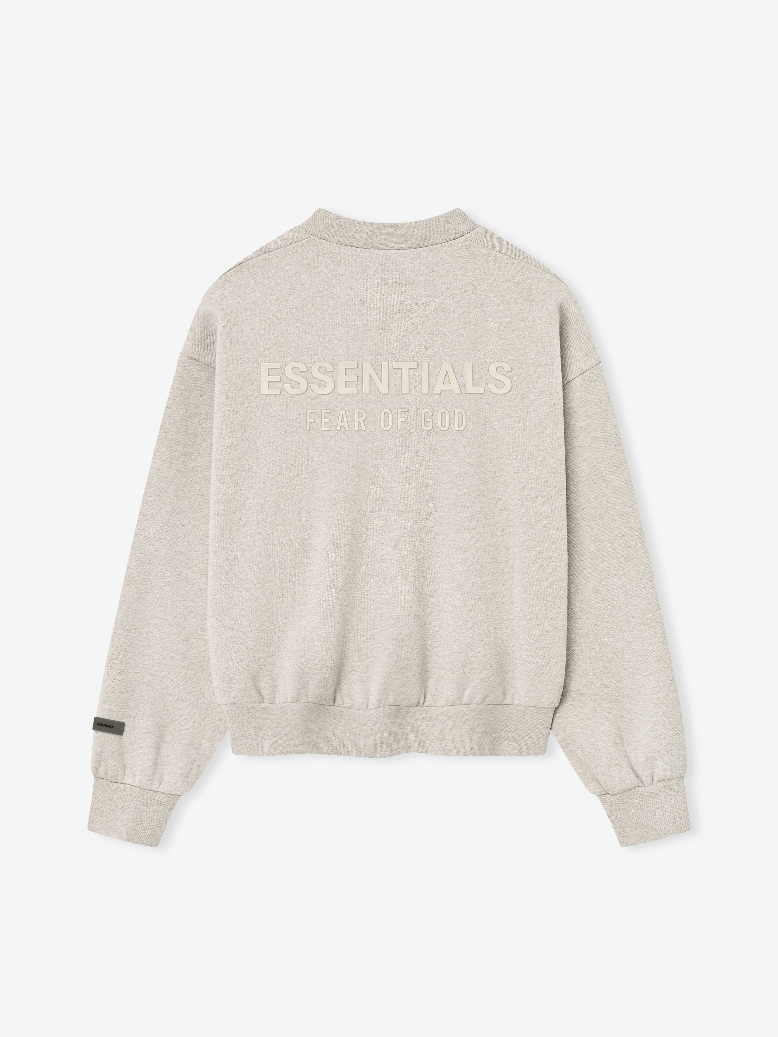 back view of light beige fleece crewneck with ribbed cuffs, hem, and embossed ESSENTIALS Fear of God logo on back