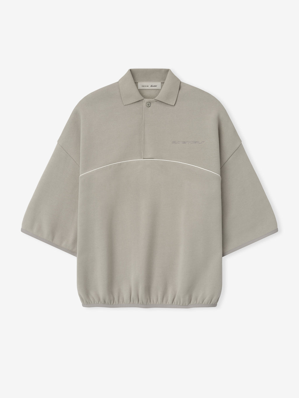 light gray cropped polo sweatshirt with 3/4 wide sleeves, subtle embroidered logo, and white piping across chest
