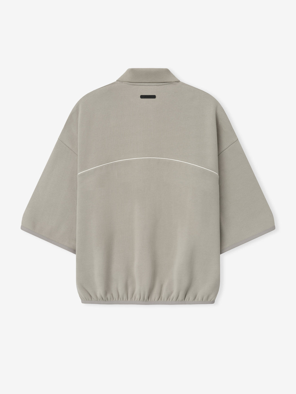 beige cropped modern polo sweatshirt with volume fit, 3/4 sleeves, elastic hem, and subtle white piping across back