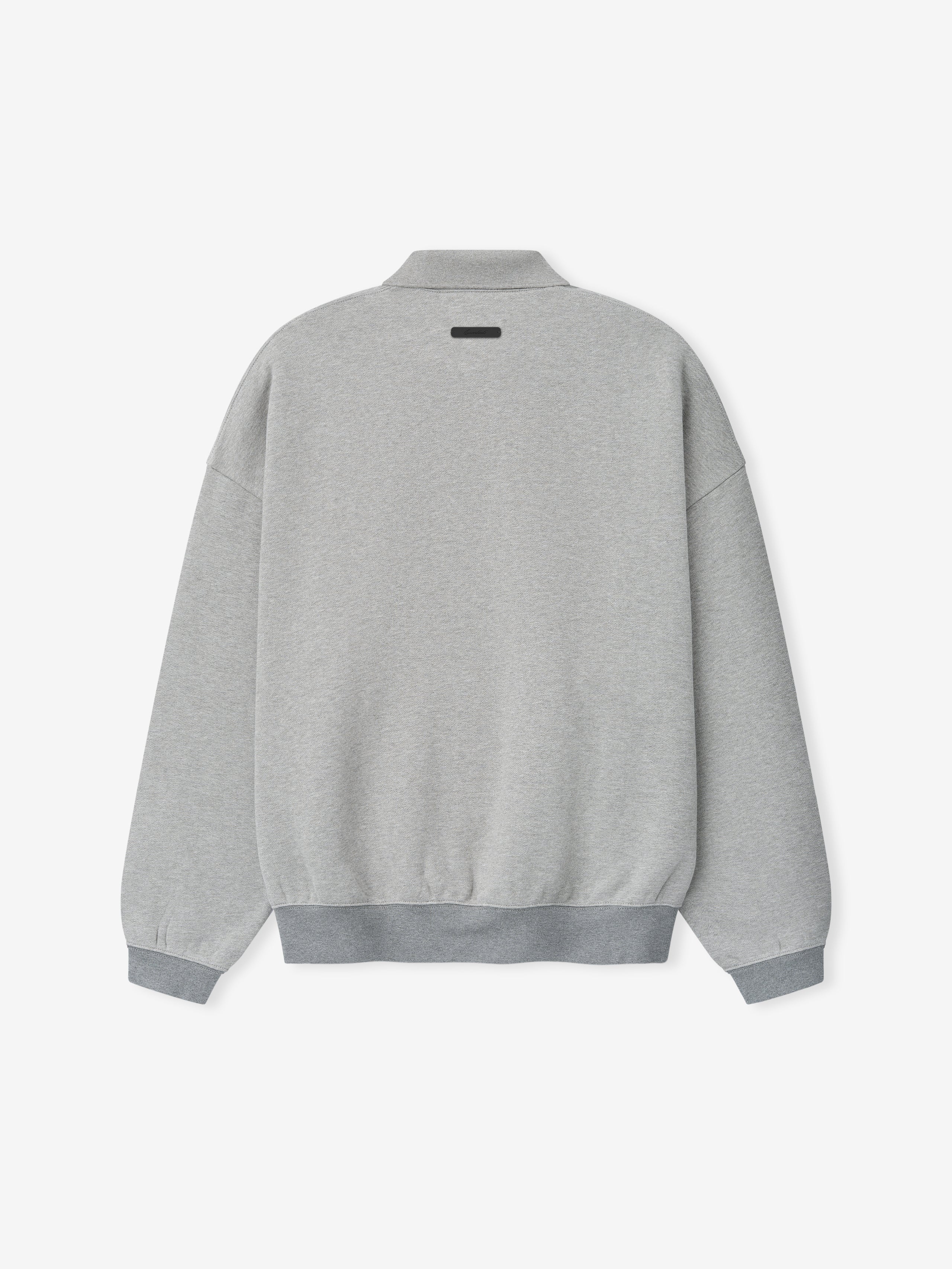 light gray 90s-inspired sweatshirt with relaxed fit, ribbed cuffs and hem, and a small rectangular patch on upper back