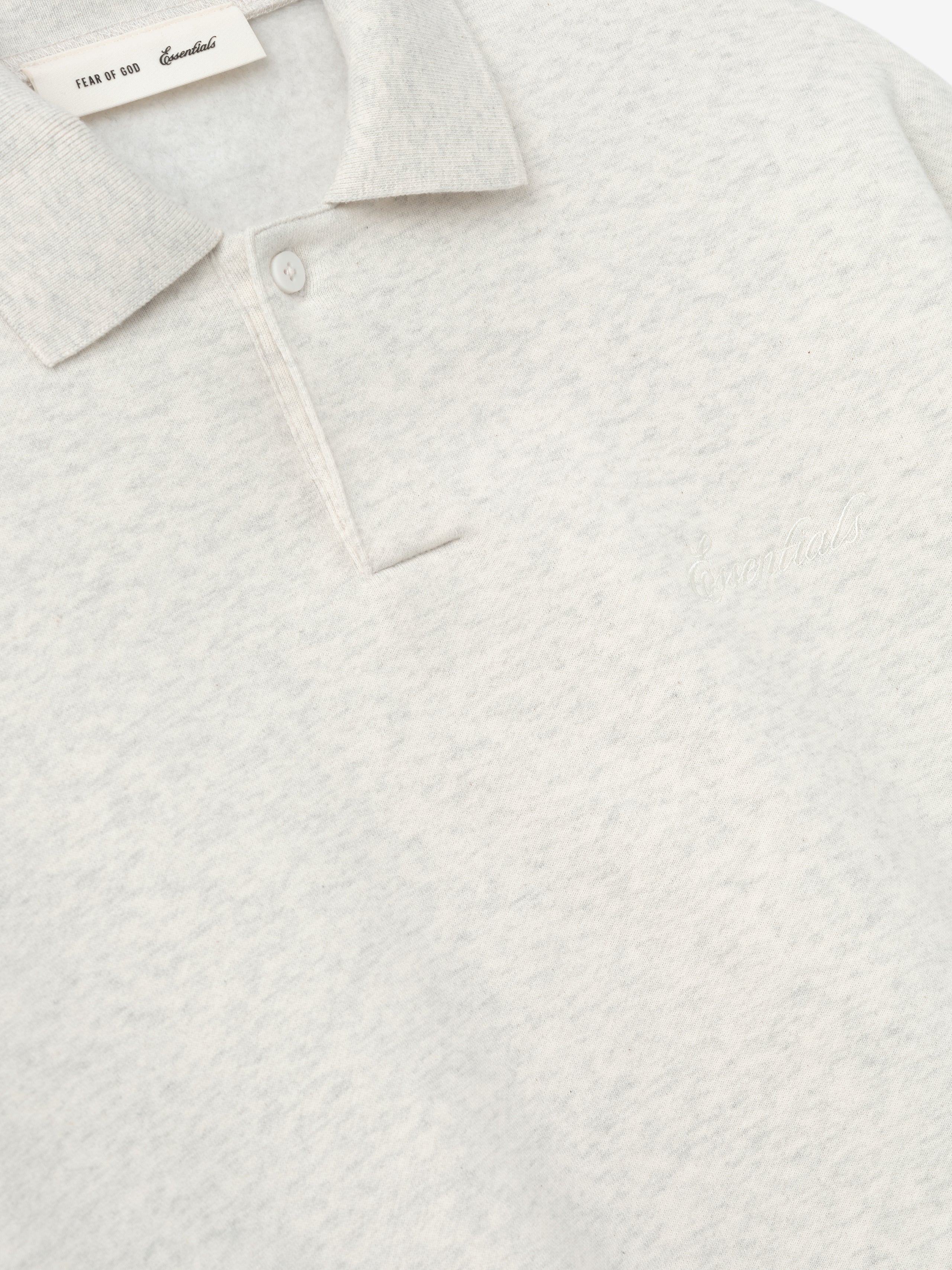 light heather gray 90s-inspired polo sweatshirt with covered button placket and subtle embroidered Essentials logo on chest