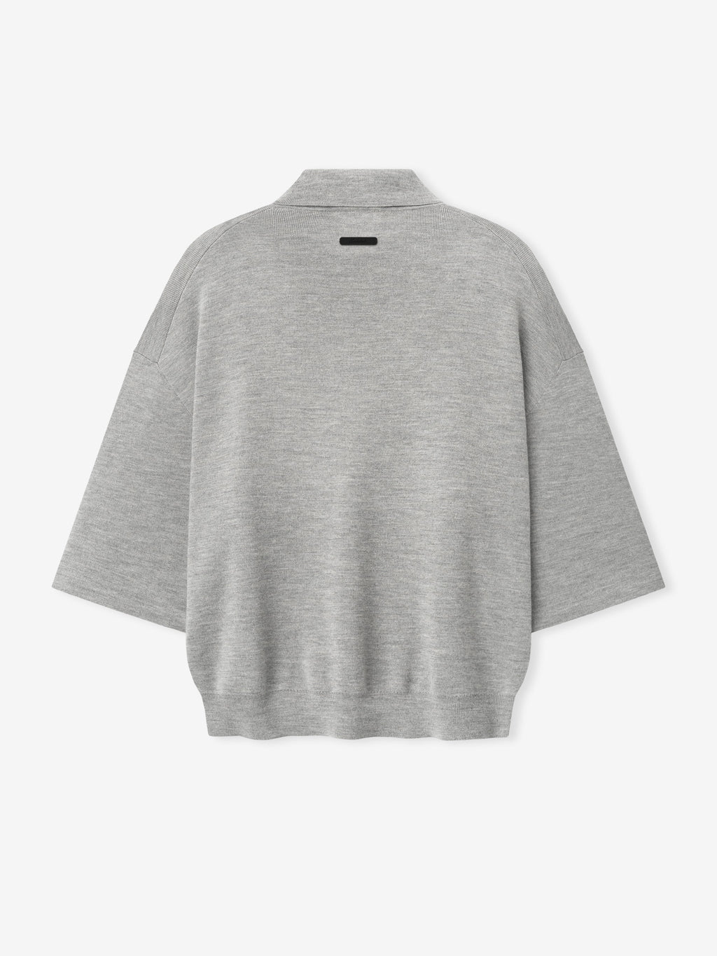 back view of light grey heavy merino knit polo with 3/4 sleeves and relaxed fit featuring small black label on neckline