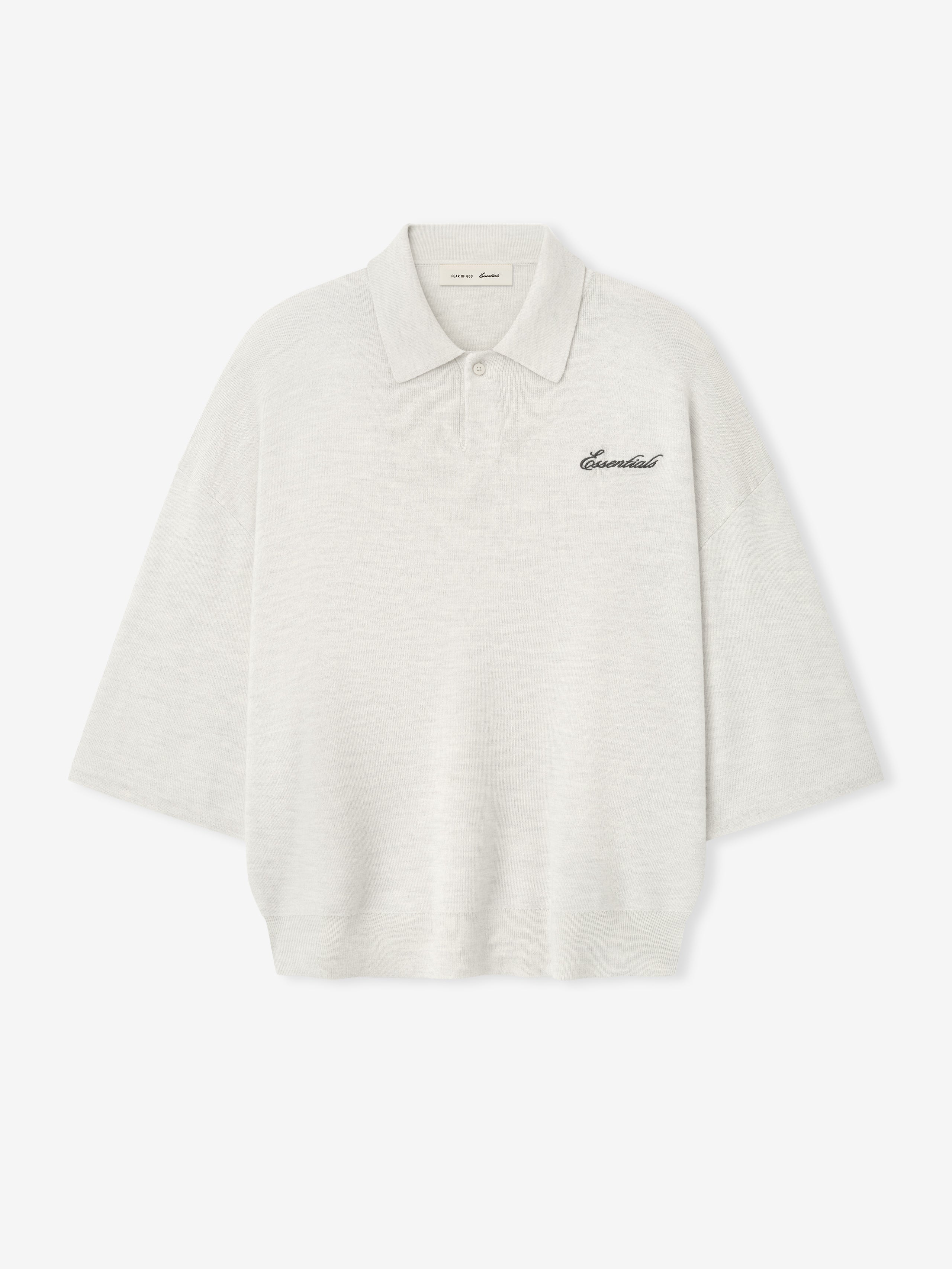 off-white heavy merino knit polo with 3/4 sleeves, relaxed fit, classic collar, and black Essentials script embroidery on chest
