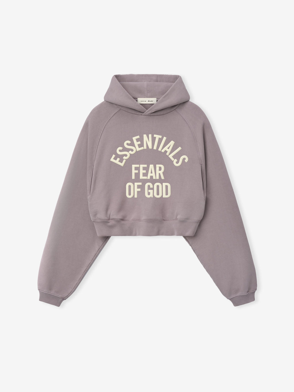 Mauve cropped hoodie with oversized sleeves and cream "ESSENTIALS FEAR OF GOD" text printed on the front panel