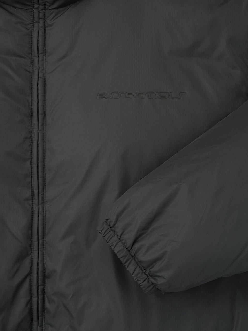 Close-up of iron grey ripstop nylon puffer jacket sleeve and chest area highlighting subtle texture and branding, file 202HO258151F_PUFFER_JACKET-IRON_GREY_3.jpg