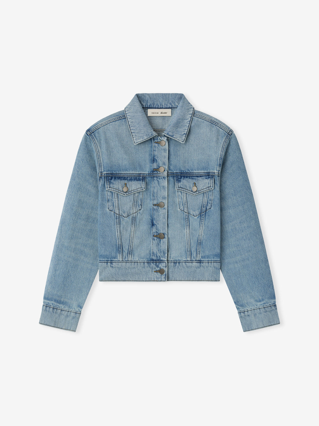 Light blue cropped denim jacket with button front, flap chest pockets, classic collar, and long sleeves on white background