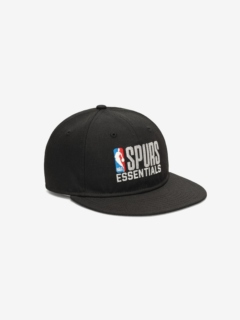 Angled front view of black Spurs 9Fifty RC Snapback featuring white NBA and Spurs Essentials embroidered logo on crown