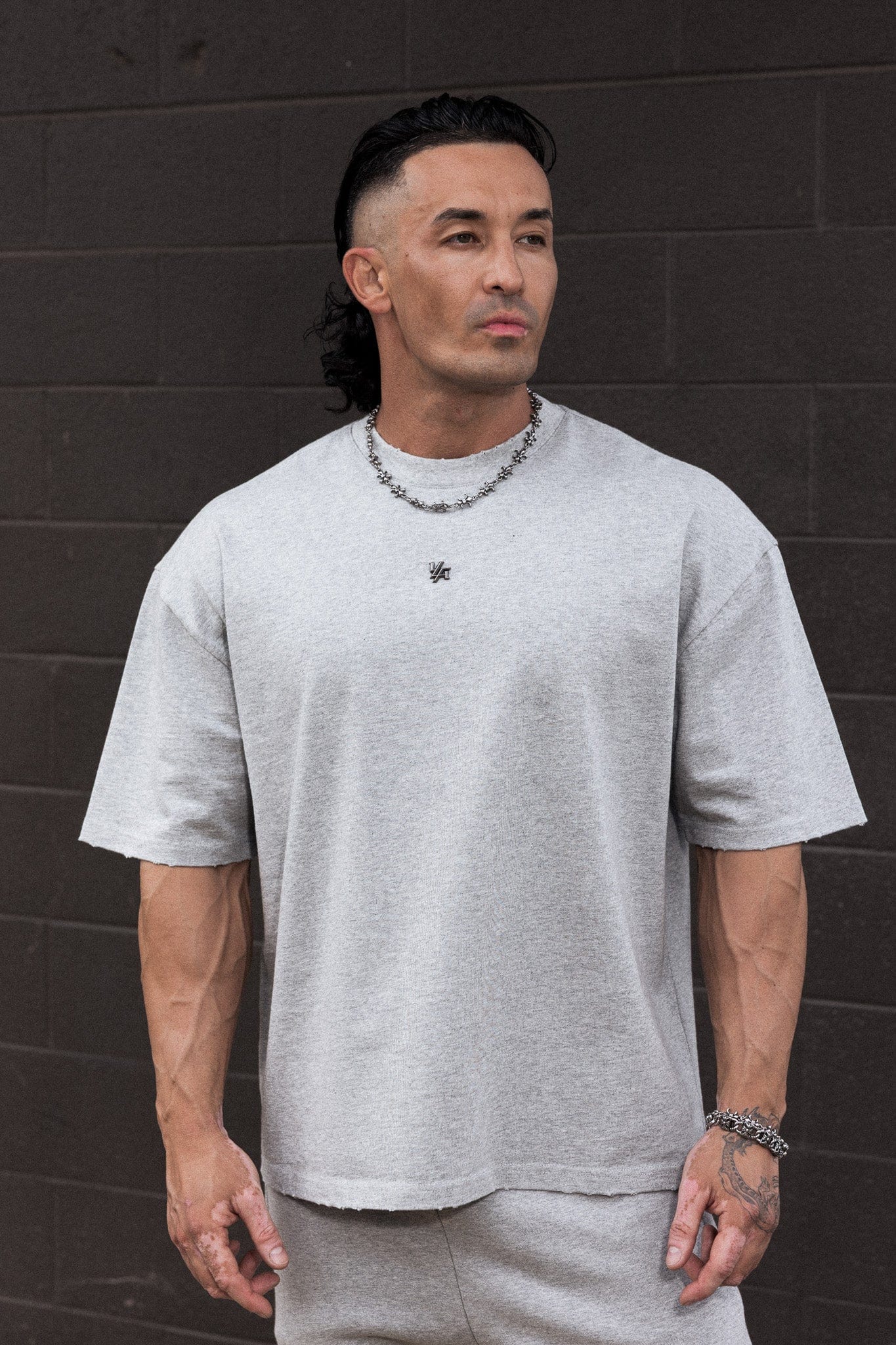 4153 - Elevated Essentials - Relaxed Tee - Oversized heavyweight cotton tee with drop shoulders, natural drape, and subtle 'Elevated' detailing in colour Heather Grey.